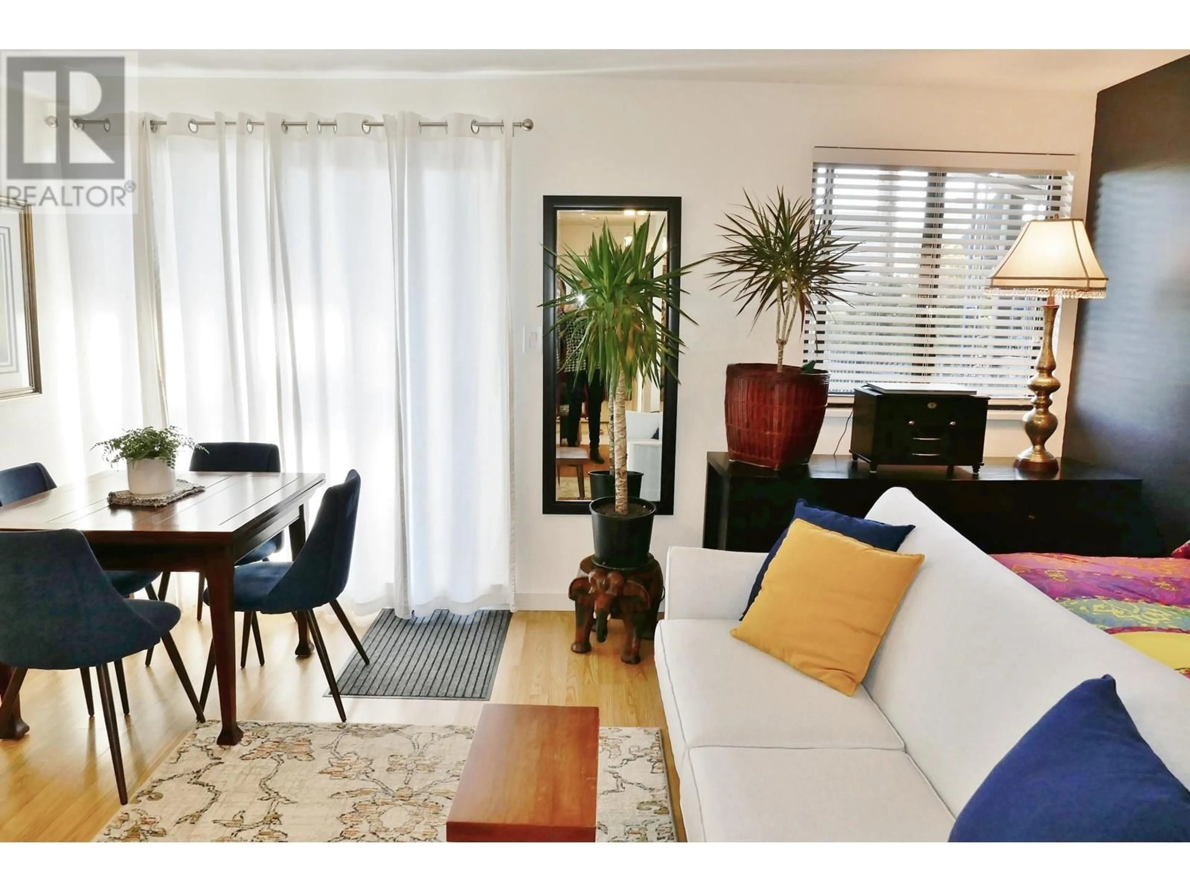 Living room with furniture, wood/laminate floor for 101 803 QUEENS AVENUE, New Westminster British Columbia V3M1L8