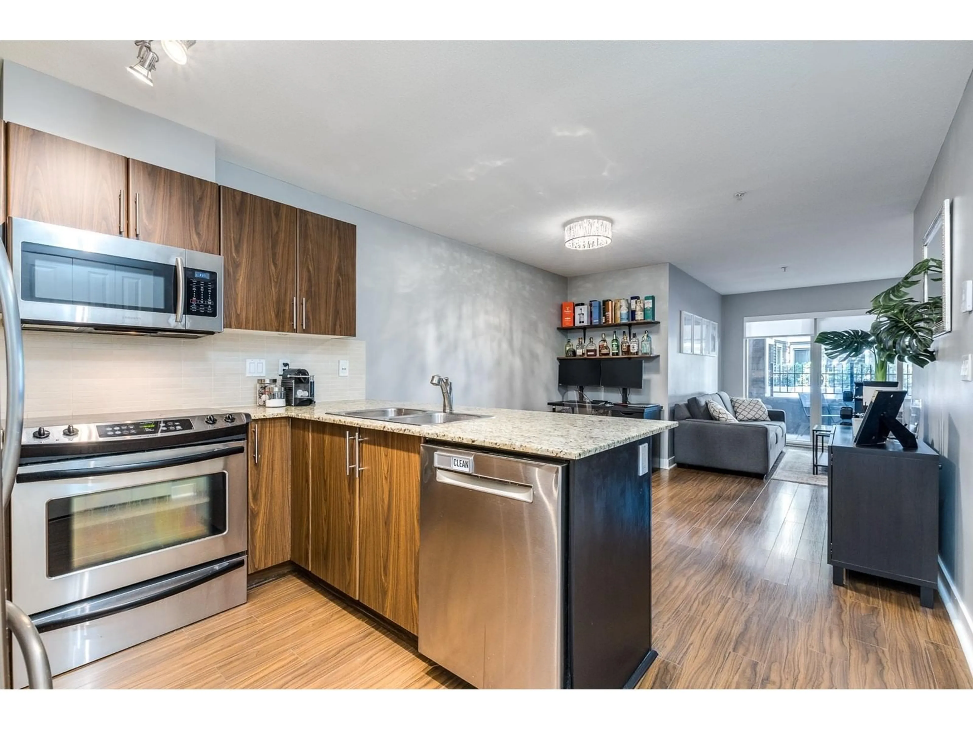 Open concept kitchen, wood/laminate floor for C102 8929 202 STREET, Langley British Columbia V1M0B4