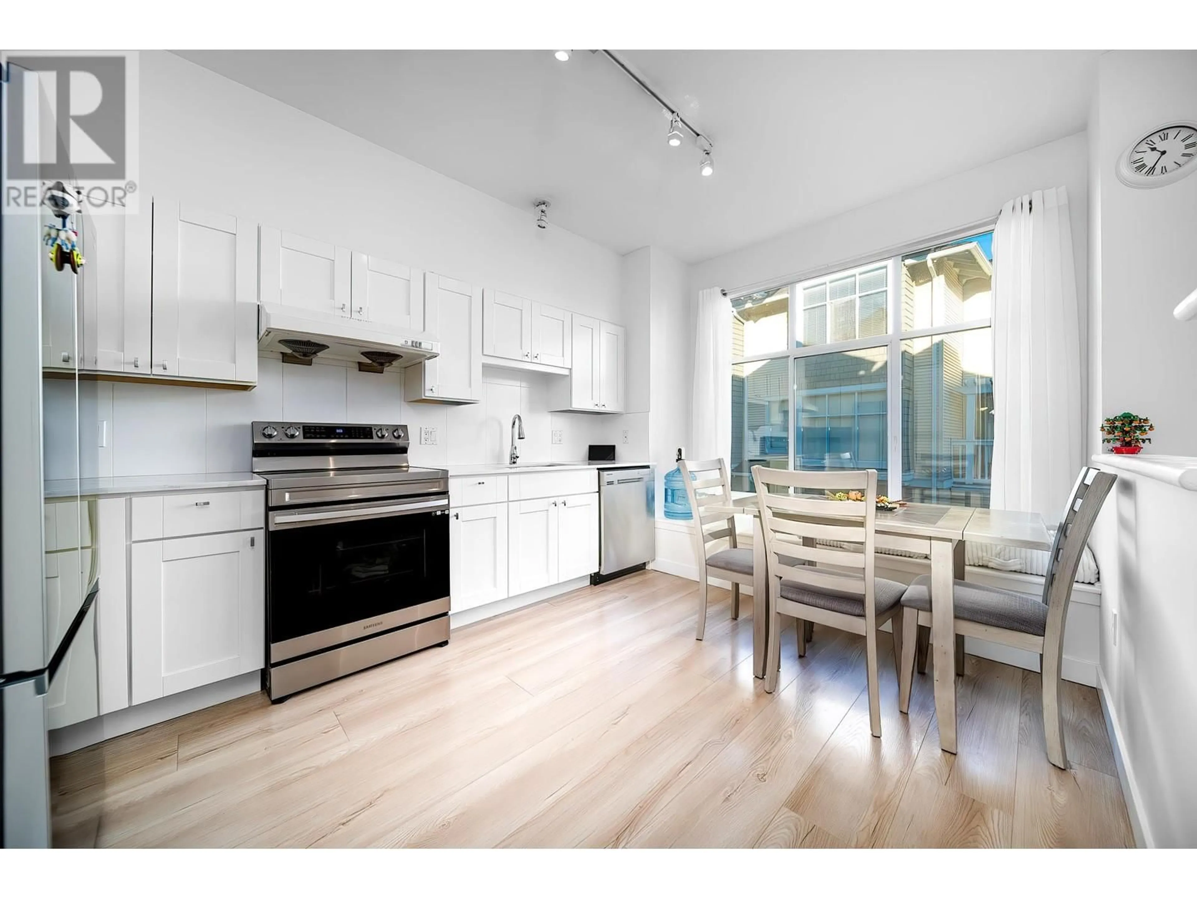 Open concept kitchen, wood/laminate floor for 20 6588 BARNARD DRIVE, Richmond British Columbia V7C5R8