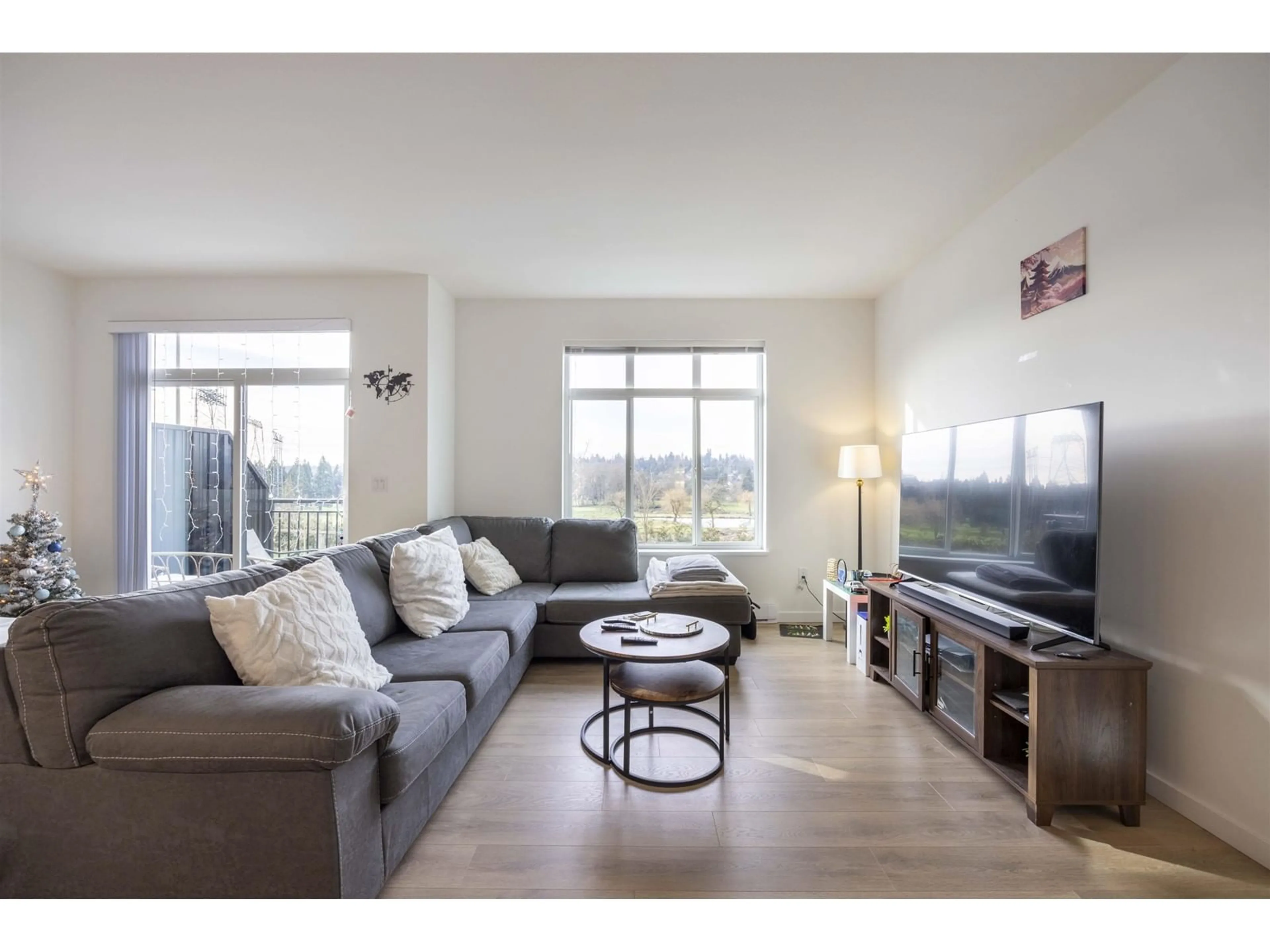 Living room with furniture, wood/laminate floor for 106 - 15255 SITKA, Surrey British Columbia V3S0B1