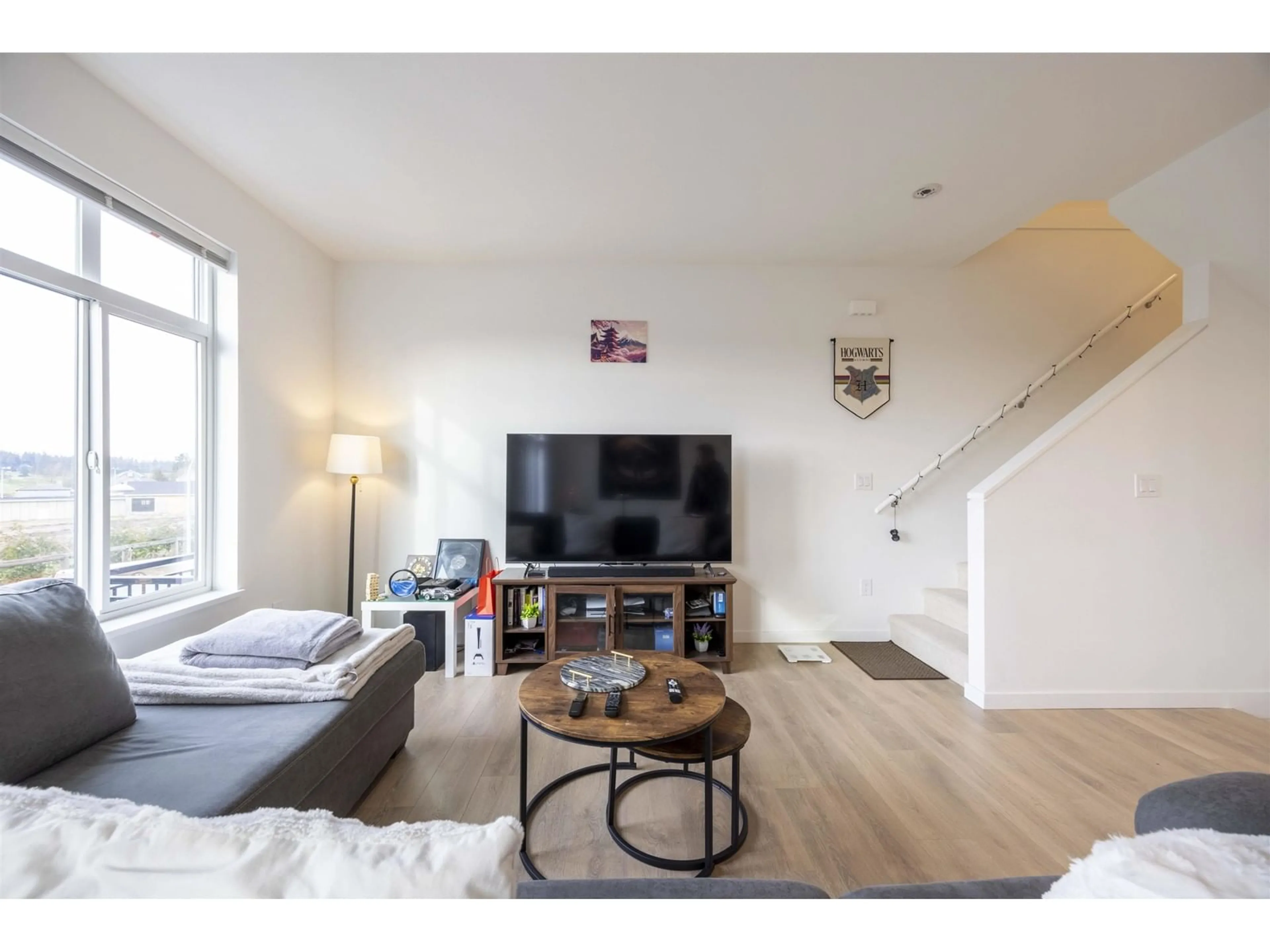 Living room with furniture, wood/laminate floor for 106 - 15255 SITKA, Surrey British Columbia V3S0B1