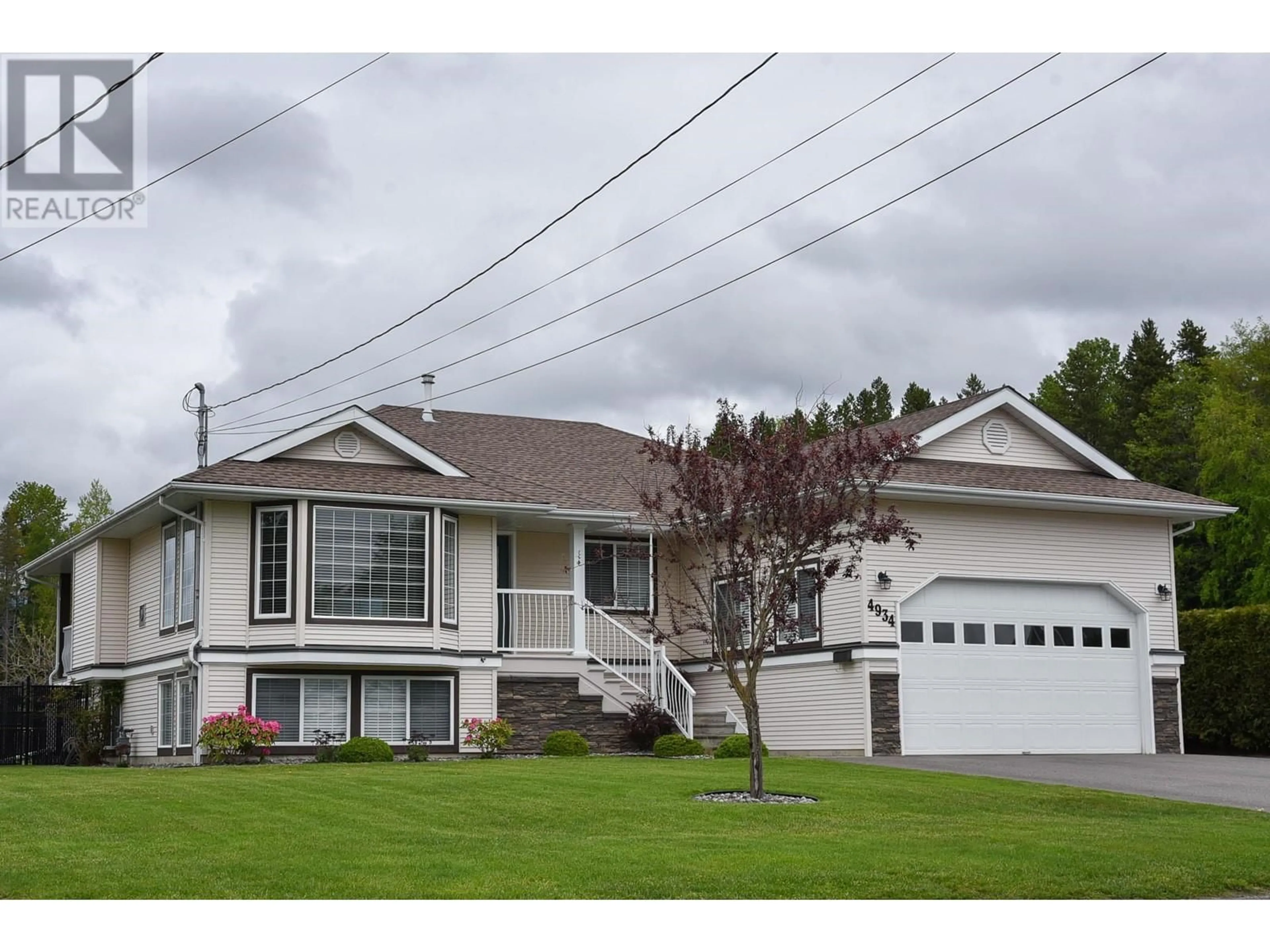 Home with vinyl exterior material, street for 4934 TWEDLE AVENUE, Terrace British Columbia V8G4G7