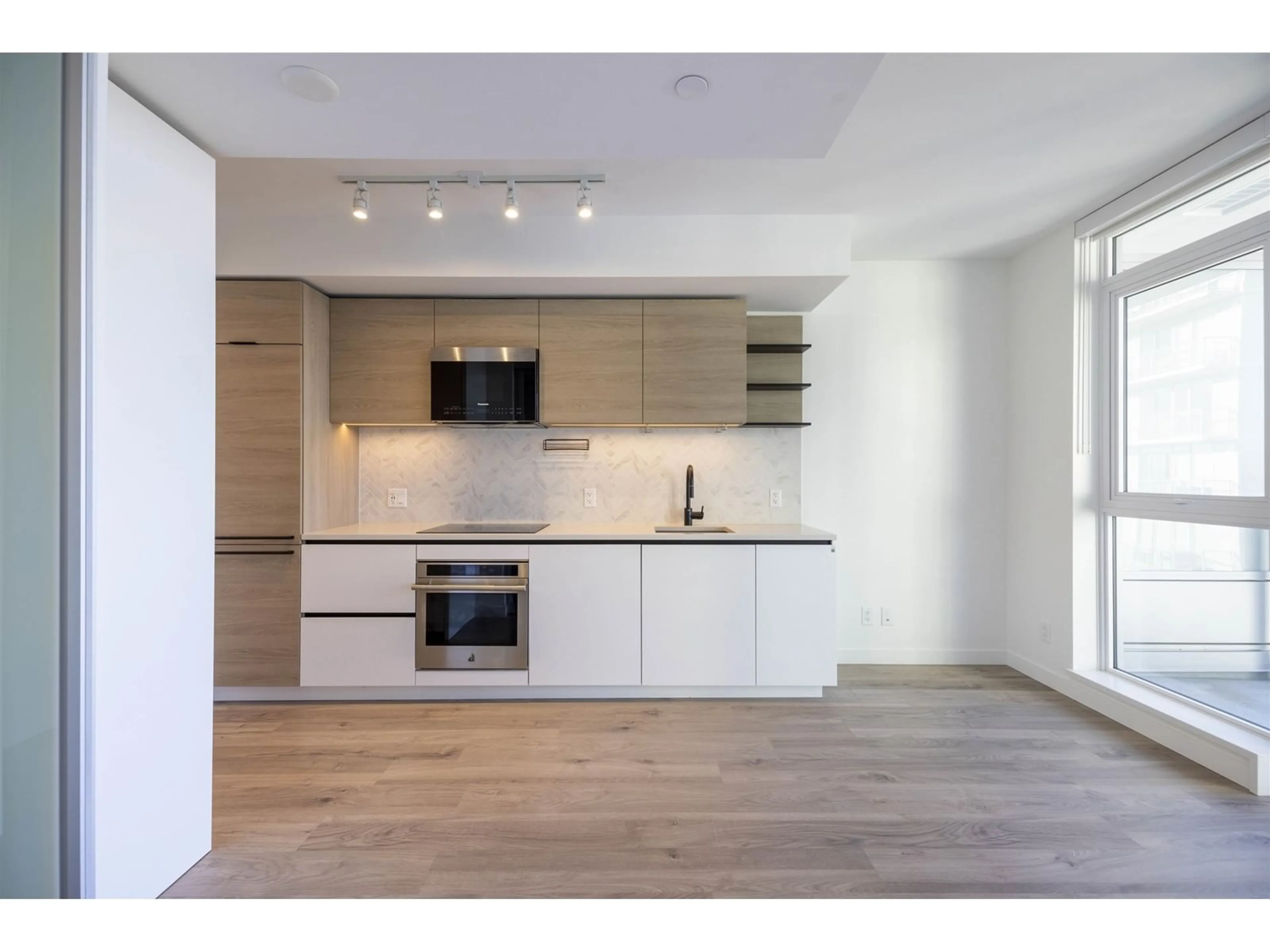 Open concept kitchen, wood/laminate floor for 2103 10448 UNIVERSITY DRIVE, Surrey British Columbia V3T0S7