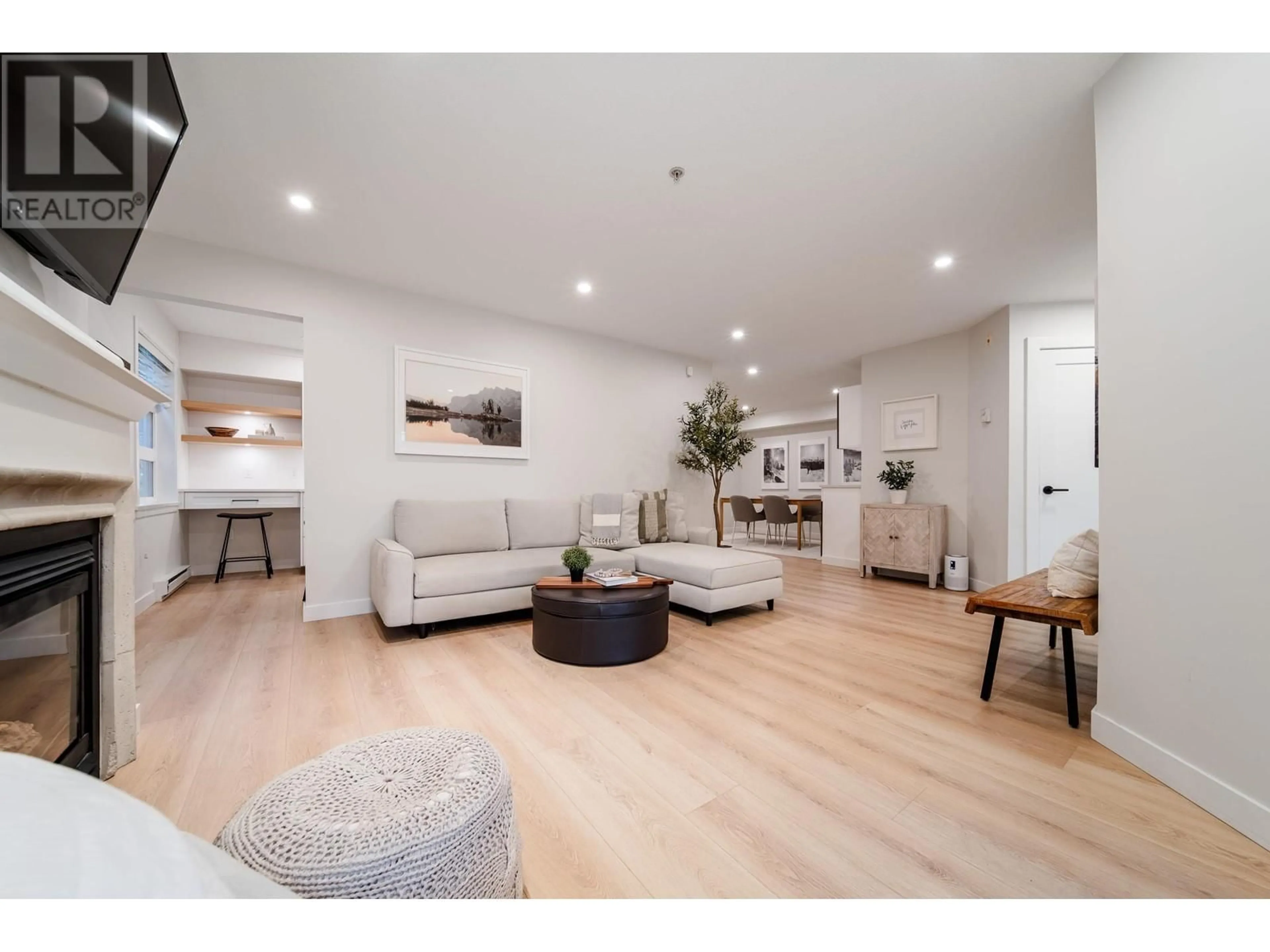 Living room with furniture, wood/laminate floor for 101 2181 W 12 AVENUE, Vancouver British Columbia V6K4S8