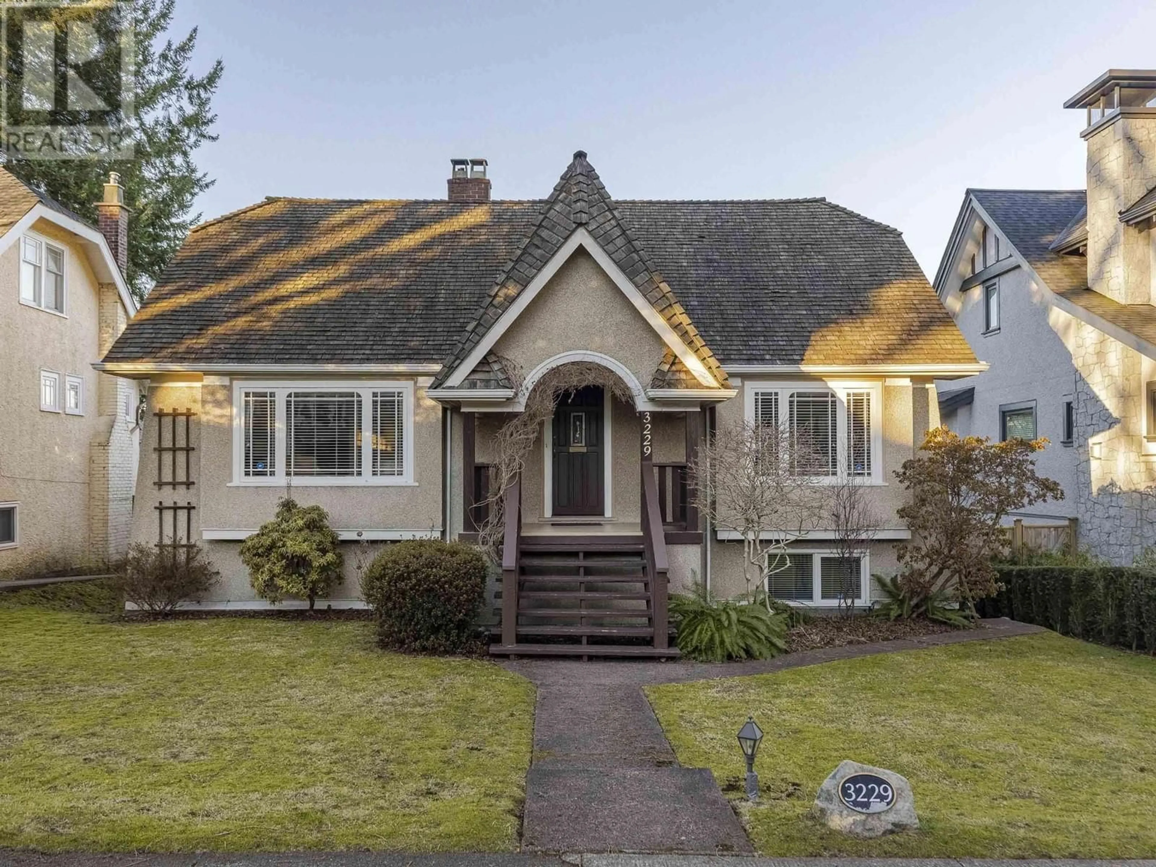 Home with vinyl exterior material, street for 3229 W 24TH AVENUE, Vancouver British Columbia V6L1R8