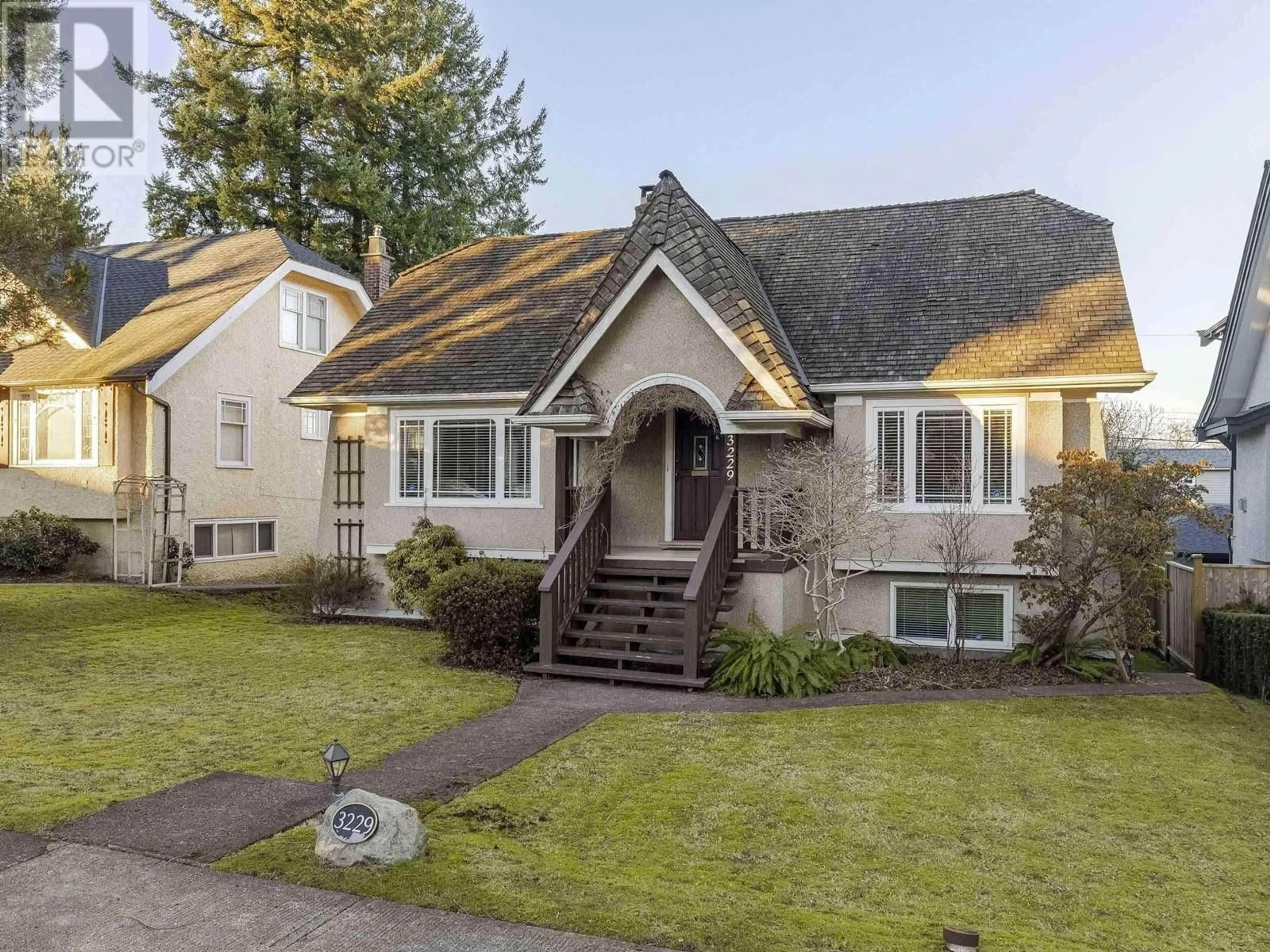 Home with vinyl exterior material, street for 3229 W 24TH AVENUE, Vancouver British Columbia V6L1R8