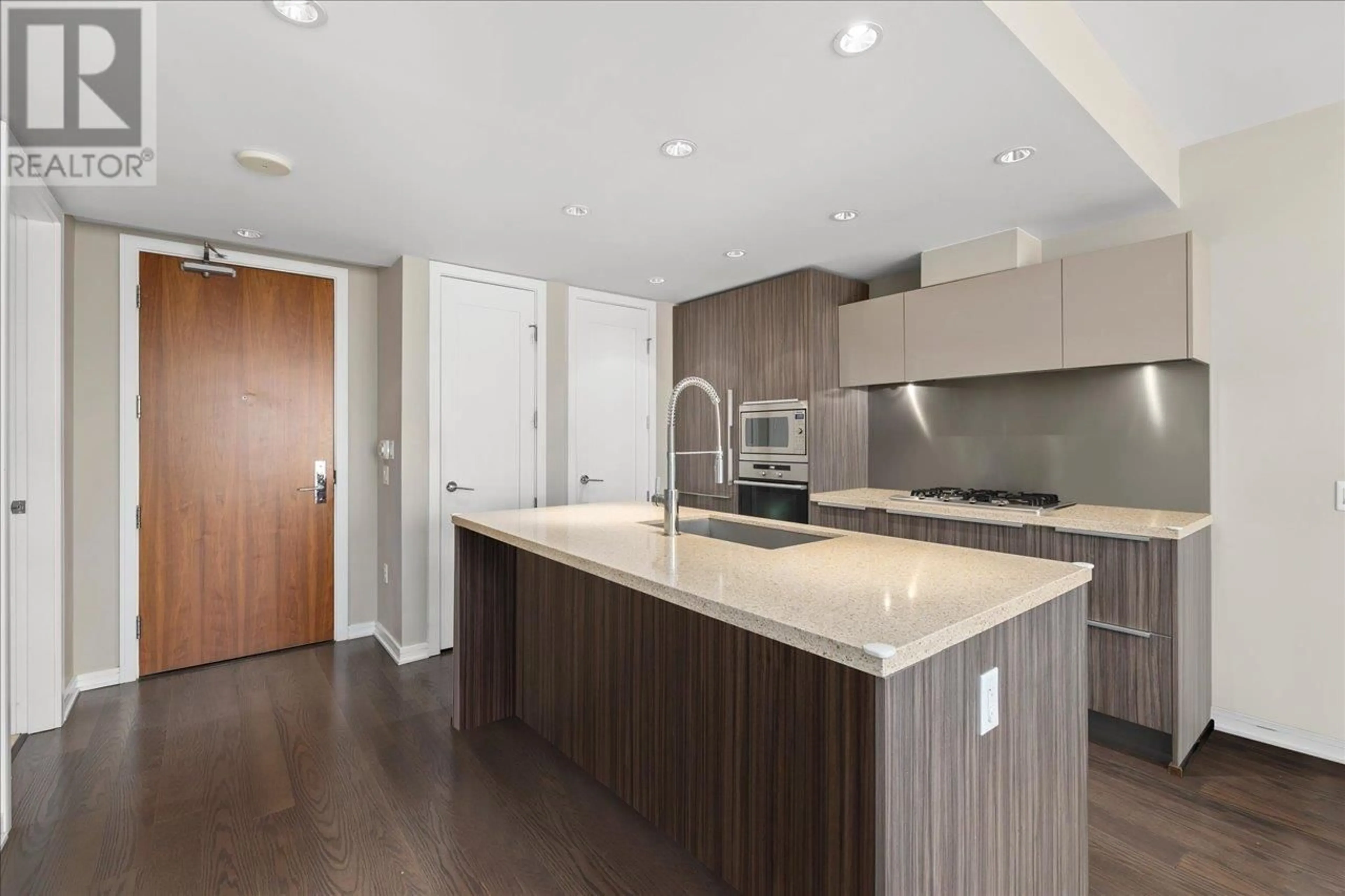 Open concept kitchen, wood/laminate floor for 706 1625 MANITOBA STREET, Vancouver British Columbia V5Y0B8