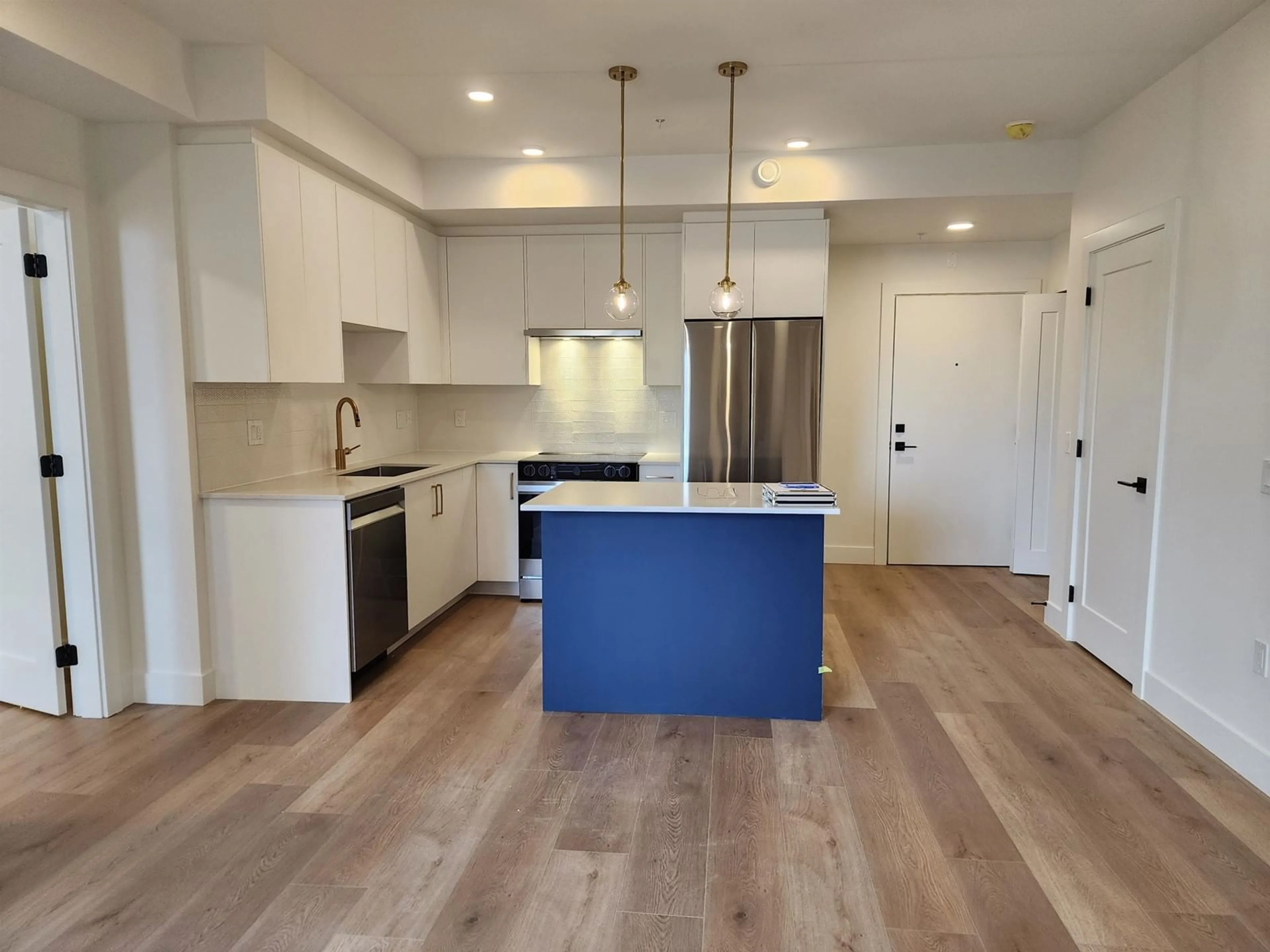 Open concept kitchen, wood/laminate floor for 101 20286 72B AVENUE, Langley British Columbia V0V0V0