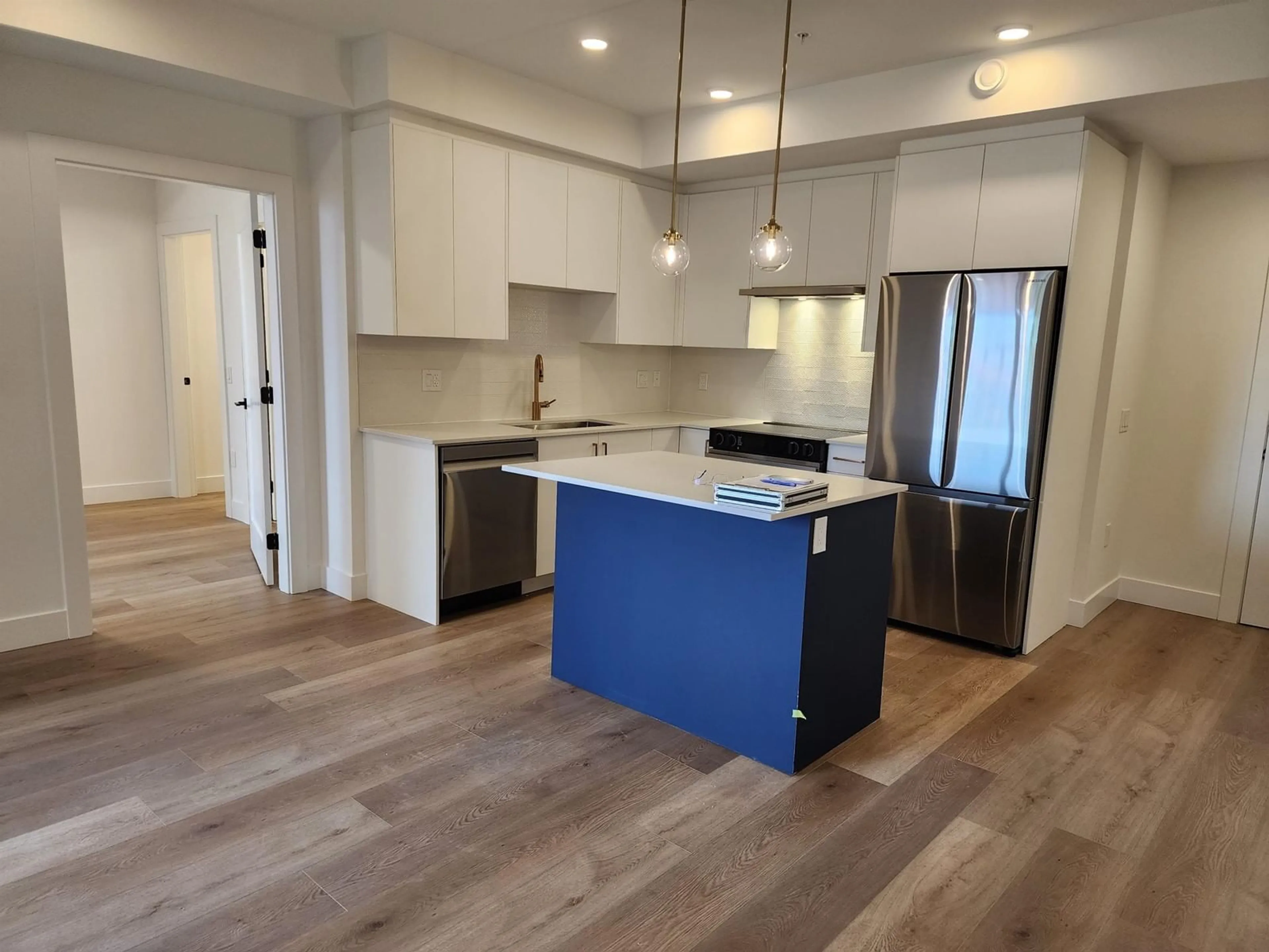 Open concept kitchen, wood/laminate floor for 101 20286 72B AVENUE, Langley British Columbia V0V0V0