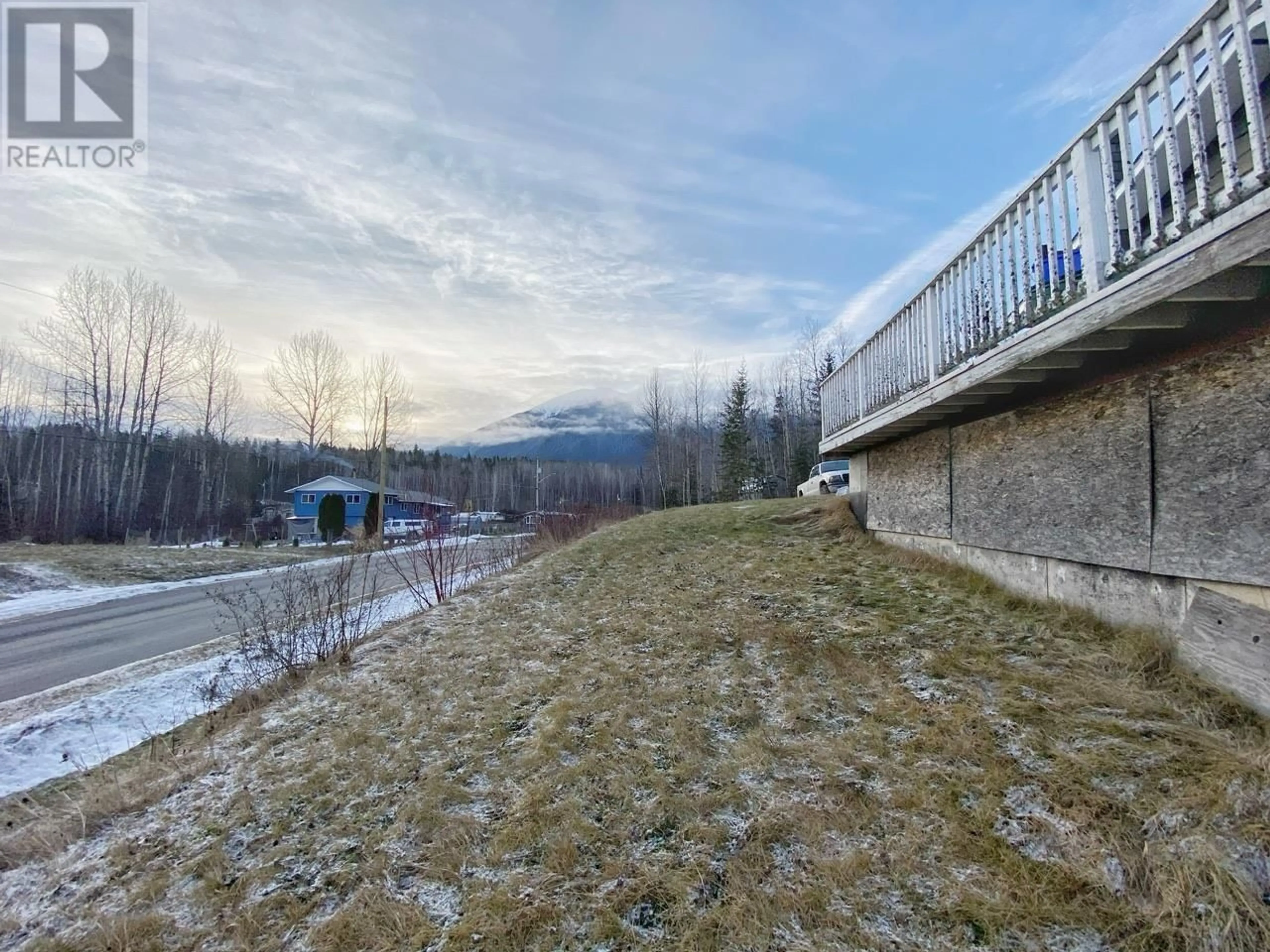 A pic from outside/outdoor area/front of a property/back of a property/a pic from drone, mountain view for 4982 7TH AVENUE, New Hazelton British Columbia V0J2J0