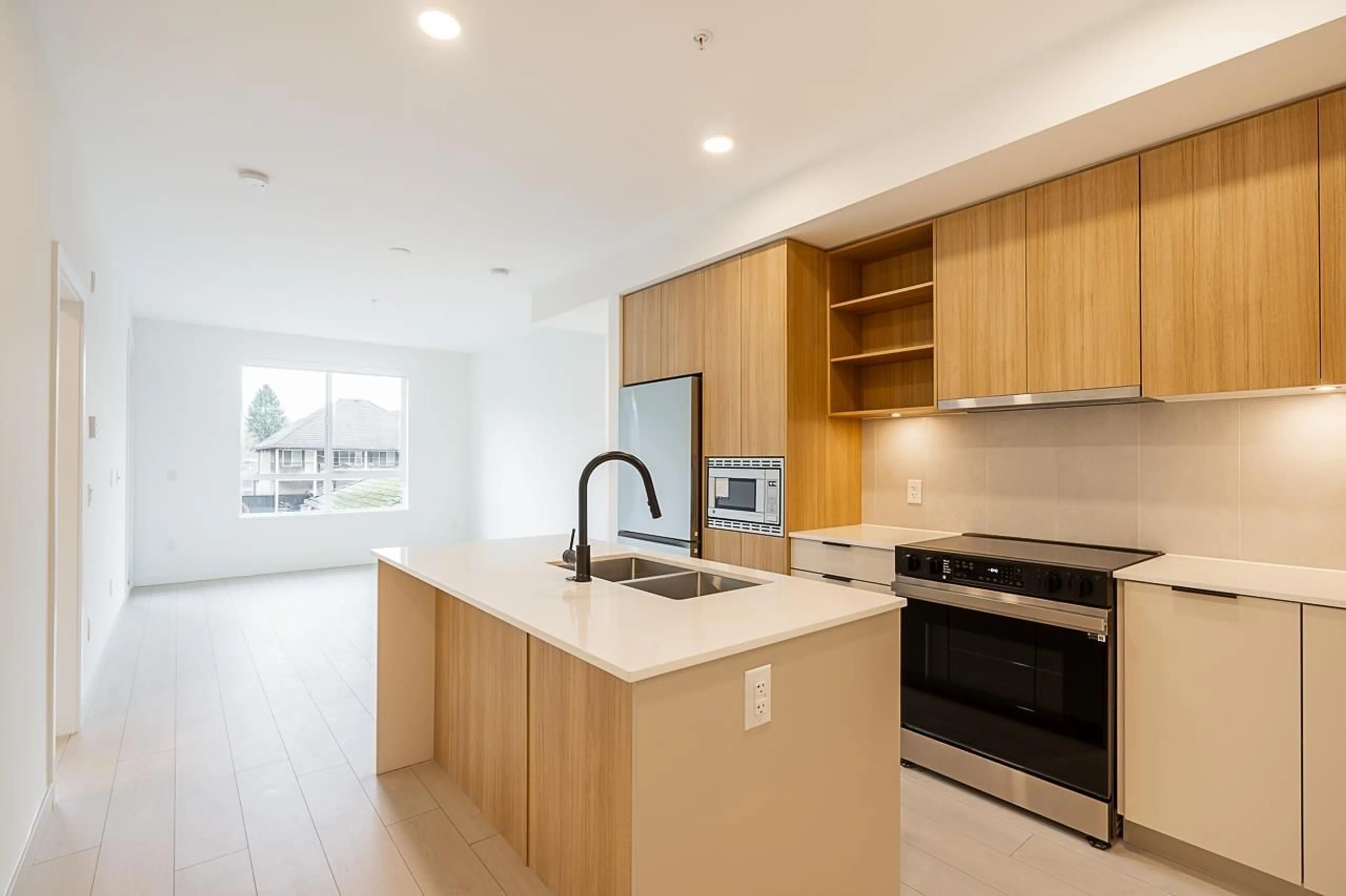 Open concept kitchen, unknown for 207 13439 94A AVENUE, Surrey British Columbia V3V0G9