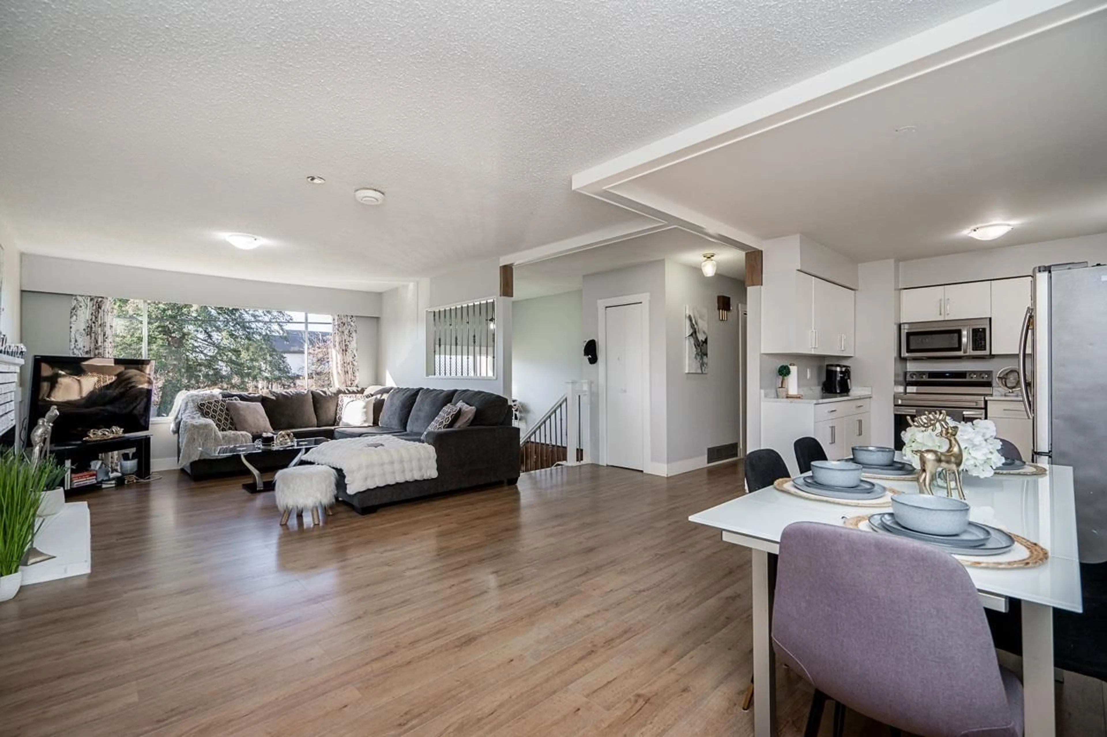 Living room with furniture, wood/laminate floor for 8186 111B STREET, Delta British Columbia V4C4S6