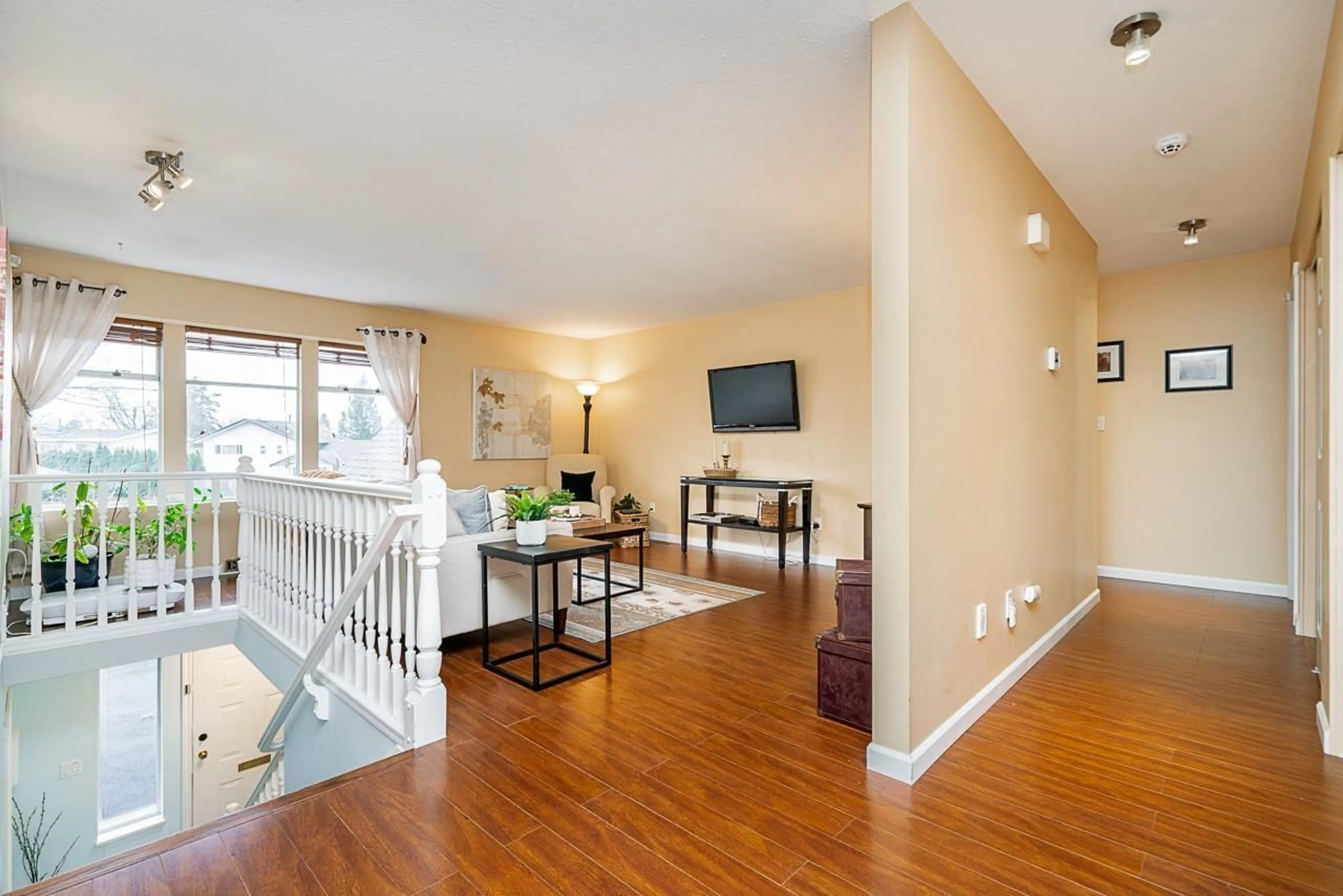 Living room with furniture, wood/laminate floor for 5106 209A STREET, Langley British Columbia V3A7K8