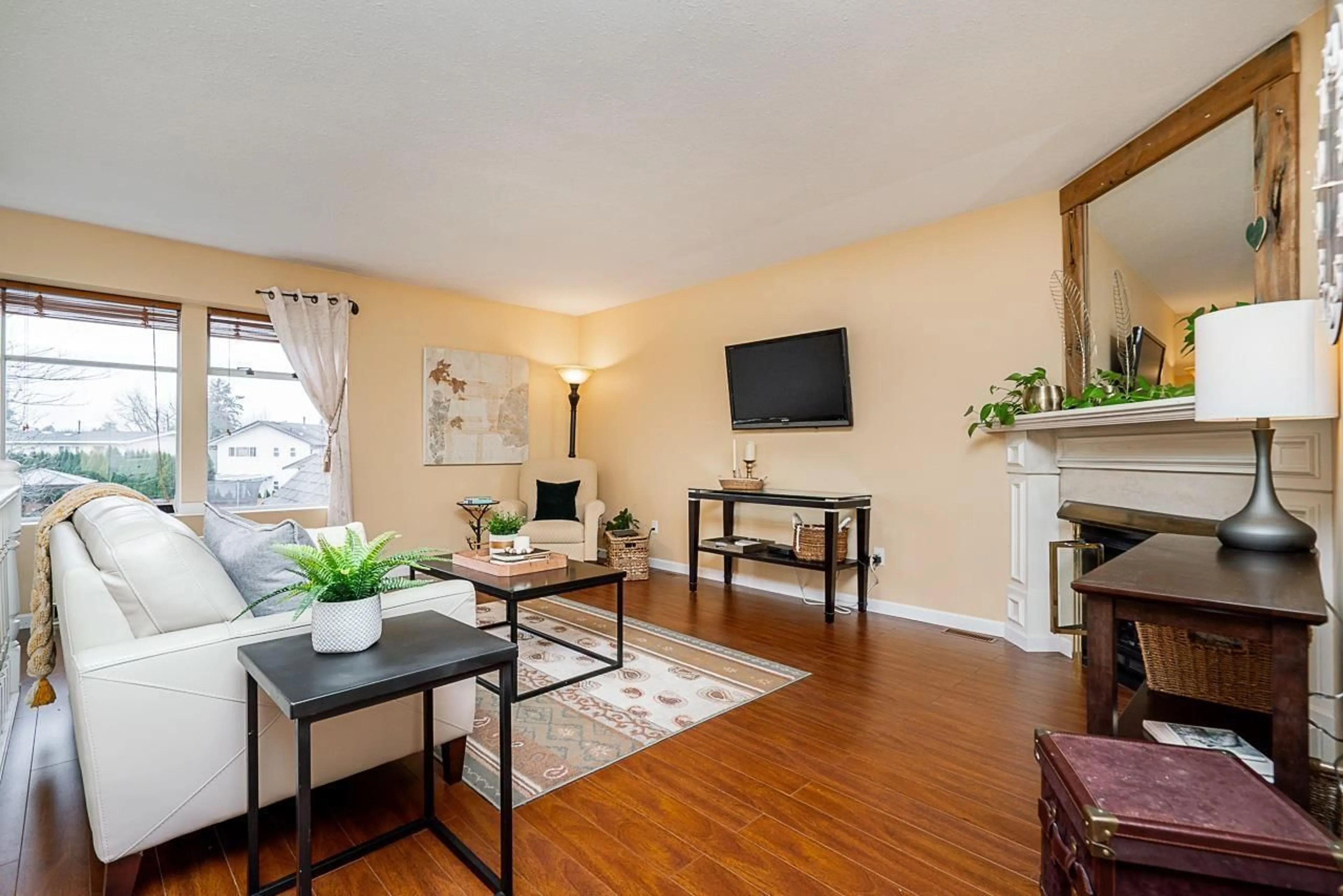 Living room with furniture, wood/laminate floor for 5106 209A STREET, Langley British Columbia V3A7K8