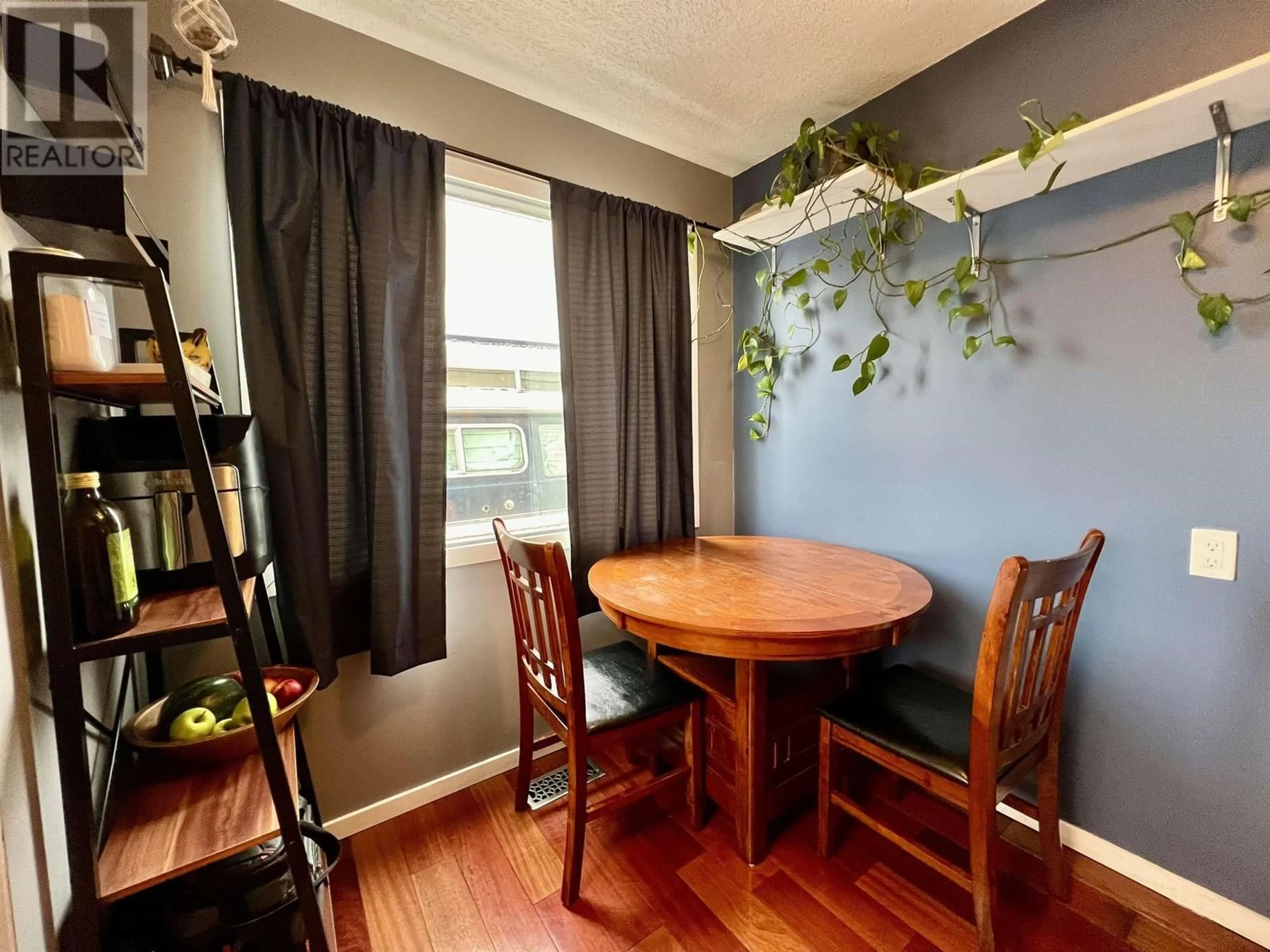 Dining room, wood/laminate floor for 4198 1ST AVENUE, Prince George British Columbia V2M5E6