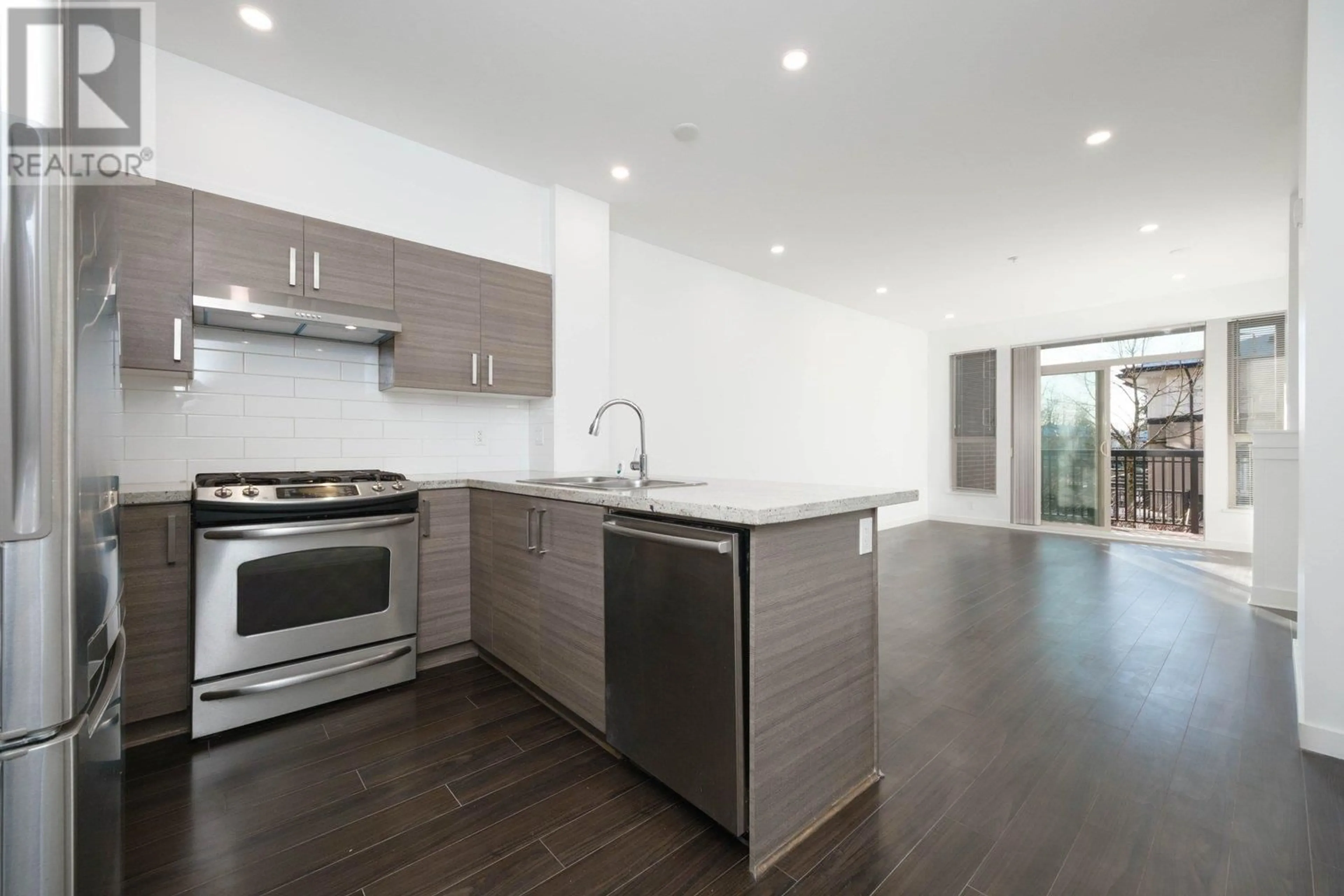 Open concept kitchen, wood/laminate floor for 207 1153 KENSAL PLACE, Coquitlam British Columbia V3B0G8