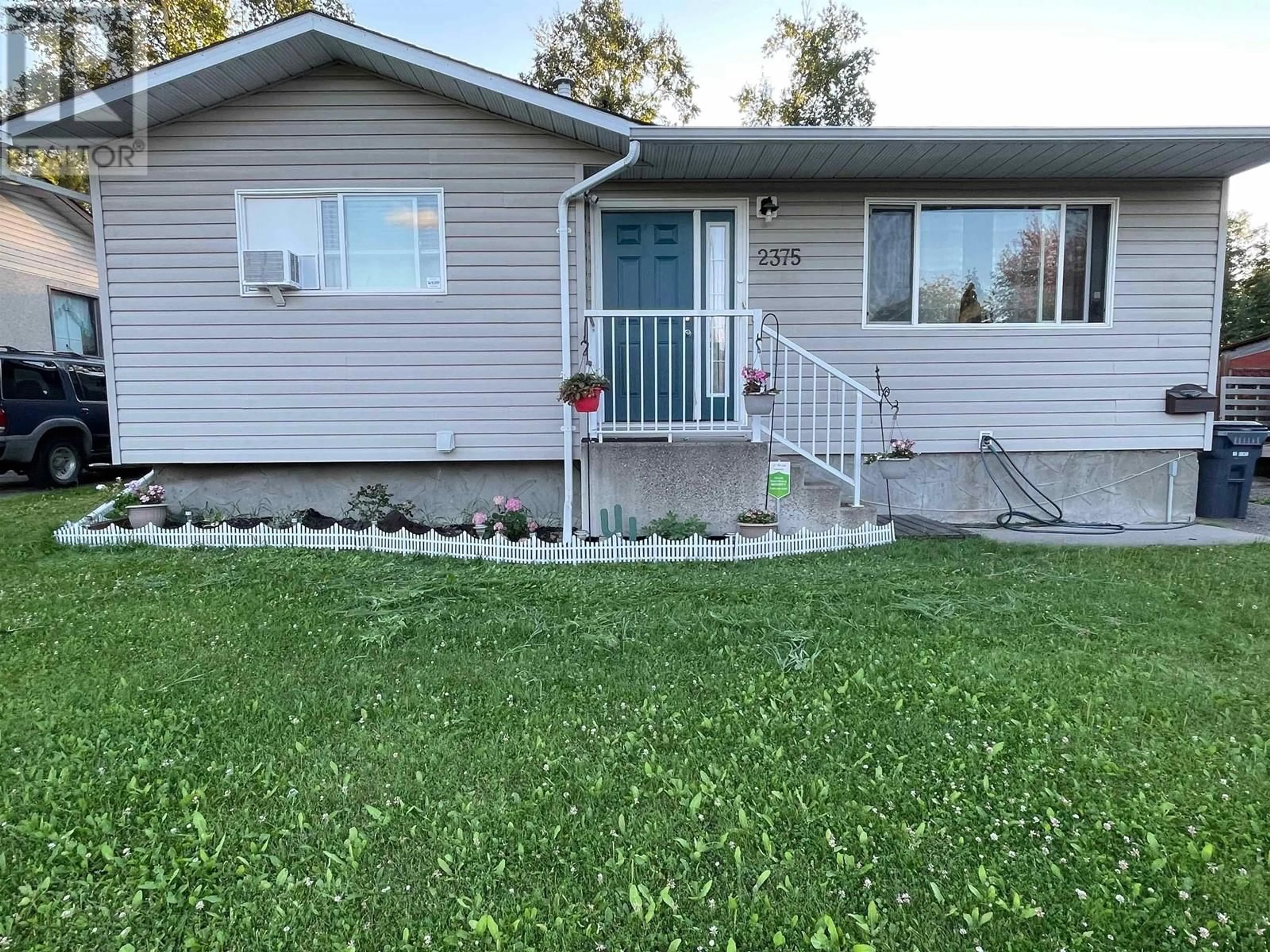 Home with vinyl exterior material, street for 2375 JASPER STREET, Prince George British Columbia V2L1P2