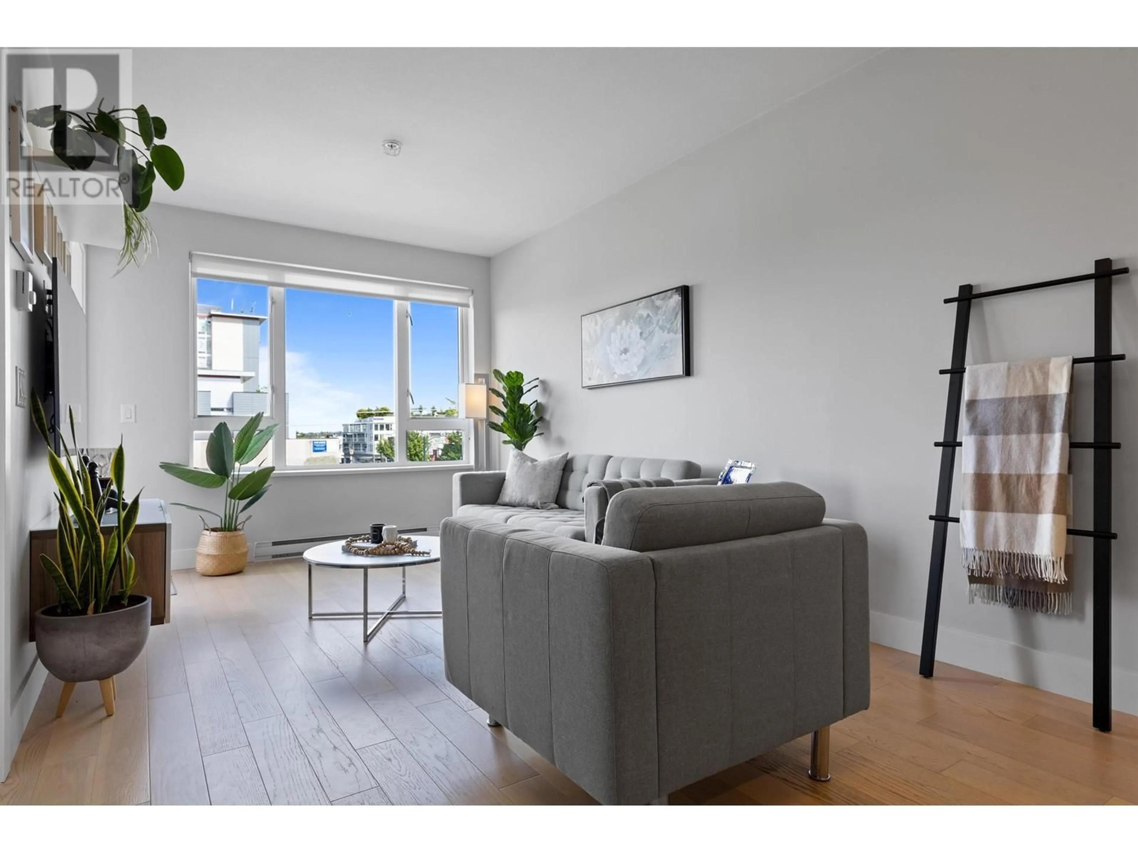 Living room with furniture, wood/laminate floor for 503 2477 CAROLINA STREET, Vancouver British Columbia V5T3S8