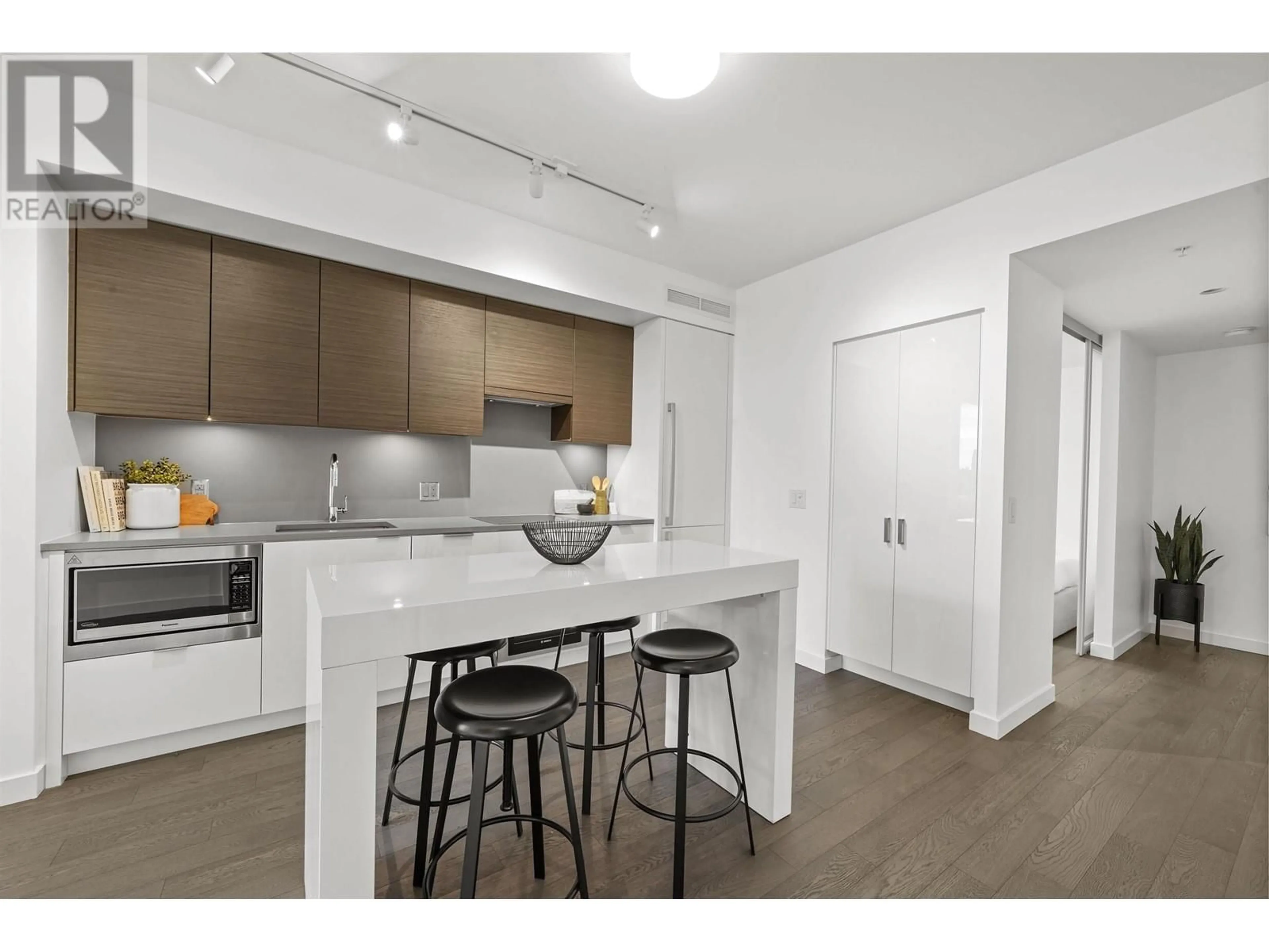 Open concept kitchen, wood/laminate floor for 902 1678 PULLMAN PORTER STREET, Vancouver British Columbia V6A0H4