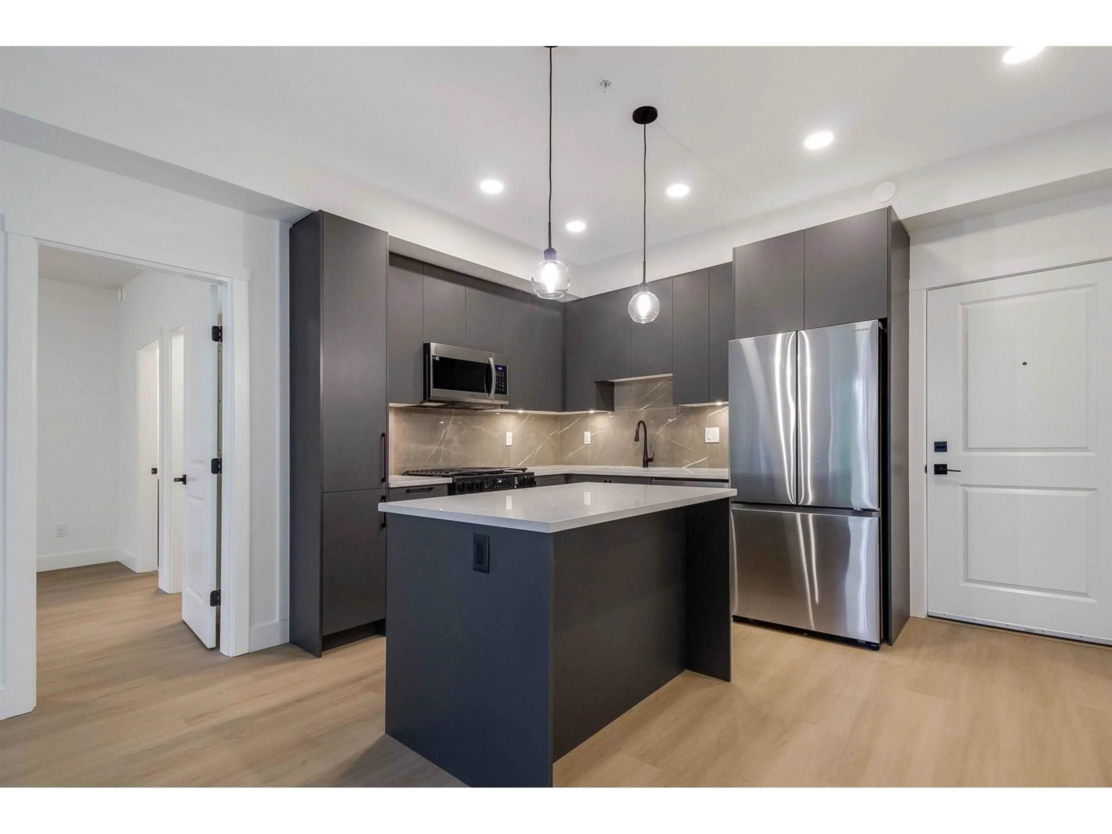 Open concept kitchen, unknown for 405 3480 146A STREET, Surrey British Columbia V4P0H6