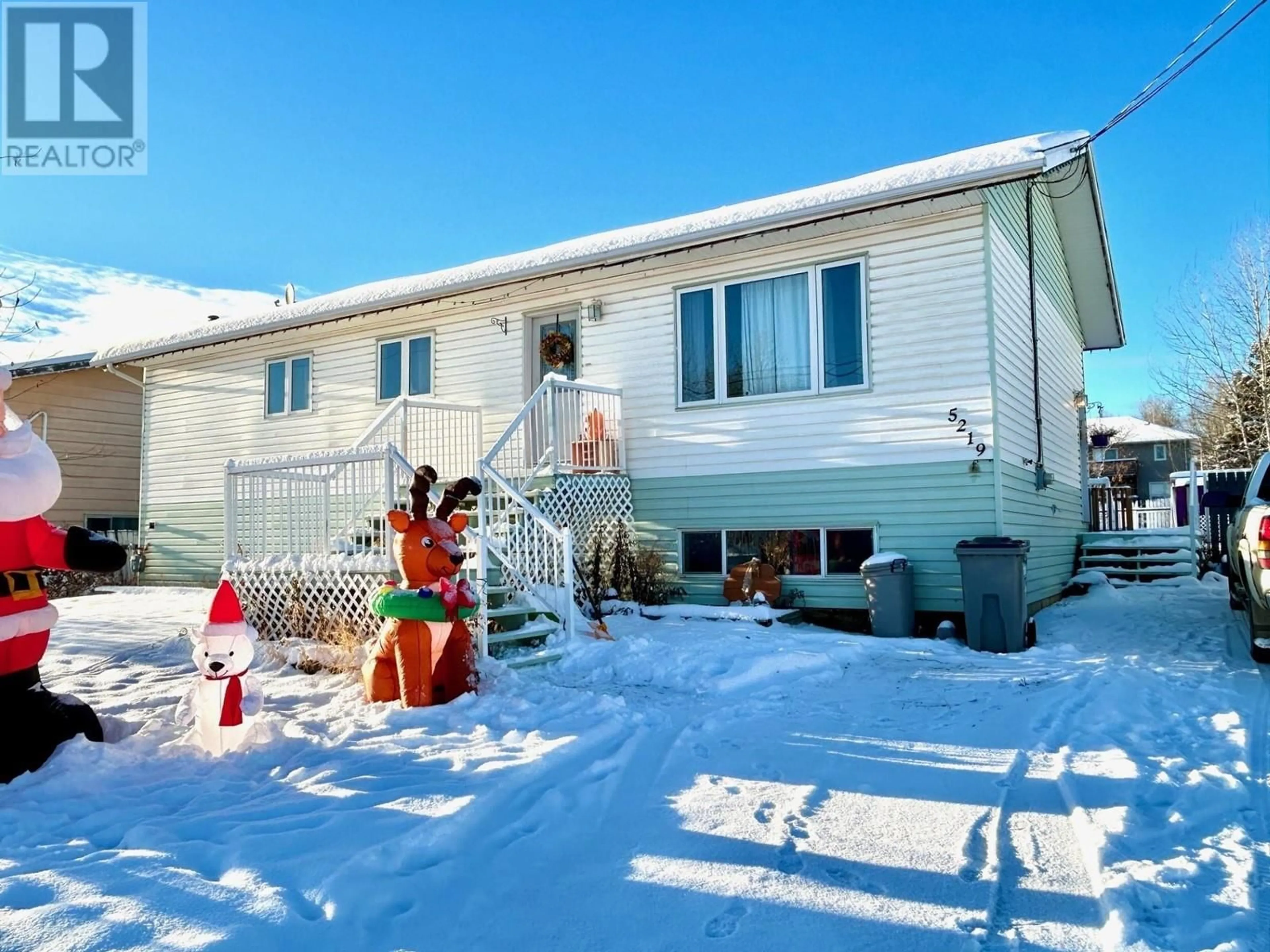 Home with vinyl exterior material, street for 5219 49 STREET, Fort Nelson British Columbia V0C1R0