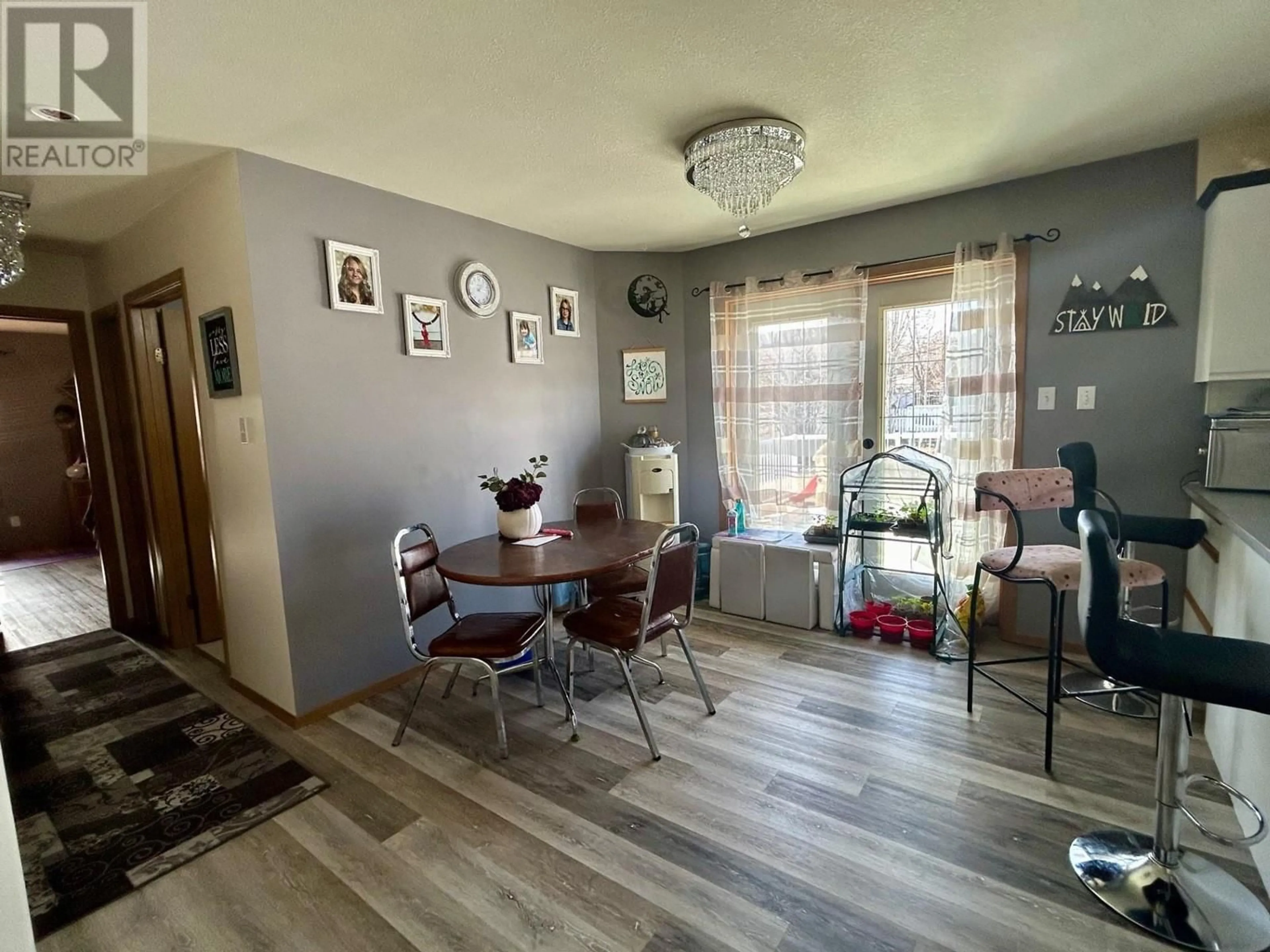 Dining room, wood/laminate floor for 5219 49 STREET, Fort Nelson British Columbia V0C1R0