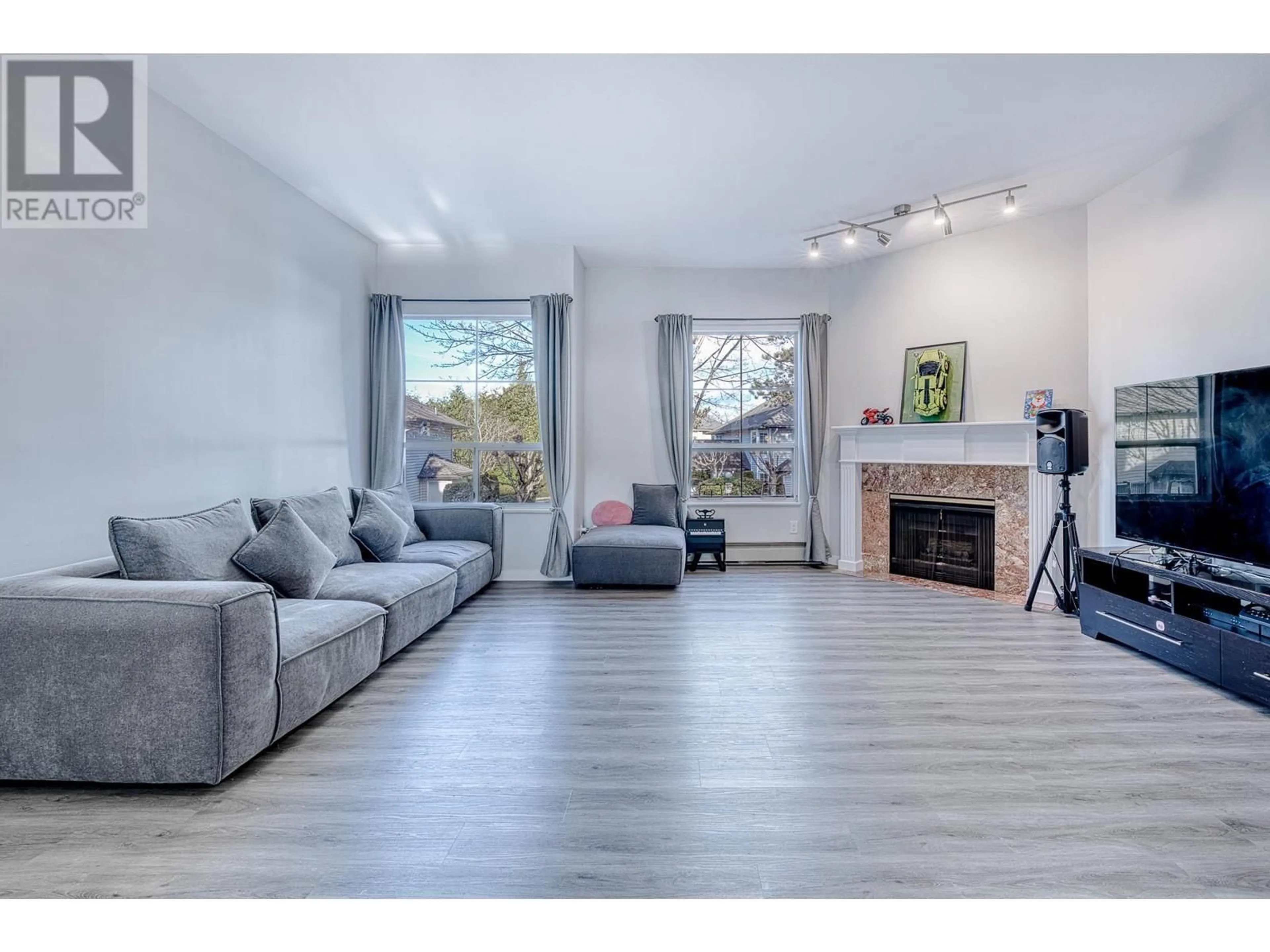 Living room with furniture, wood/laminate floor for 19 - 7380 MINORU BOULEVARD, Richmond British Columbia V6Y1Z5