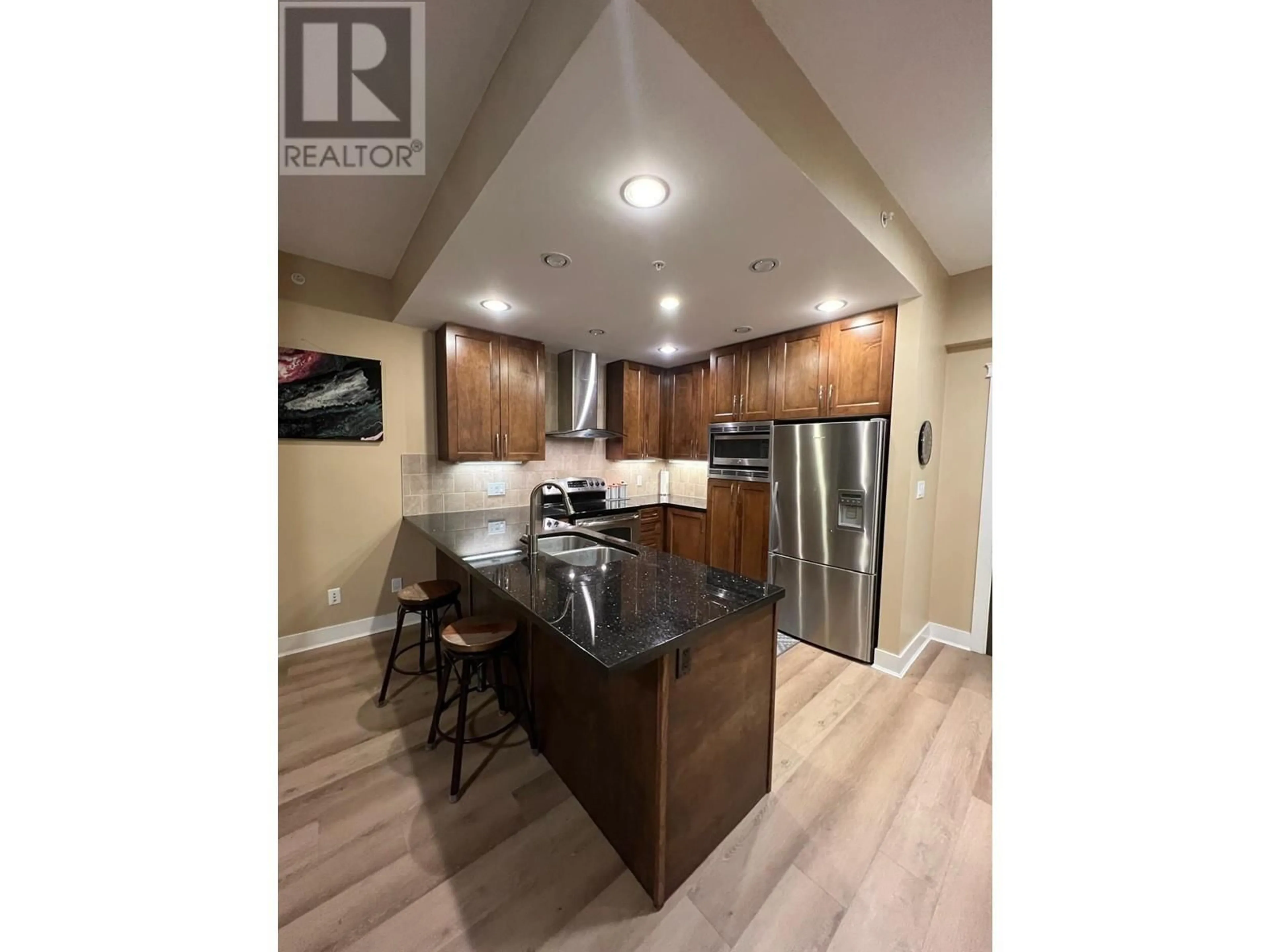 Open concept kitchen, wood/laminate floor for 811 1415 PARKWAY DRIVE, Coquitlam British Columbia V3E0C7