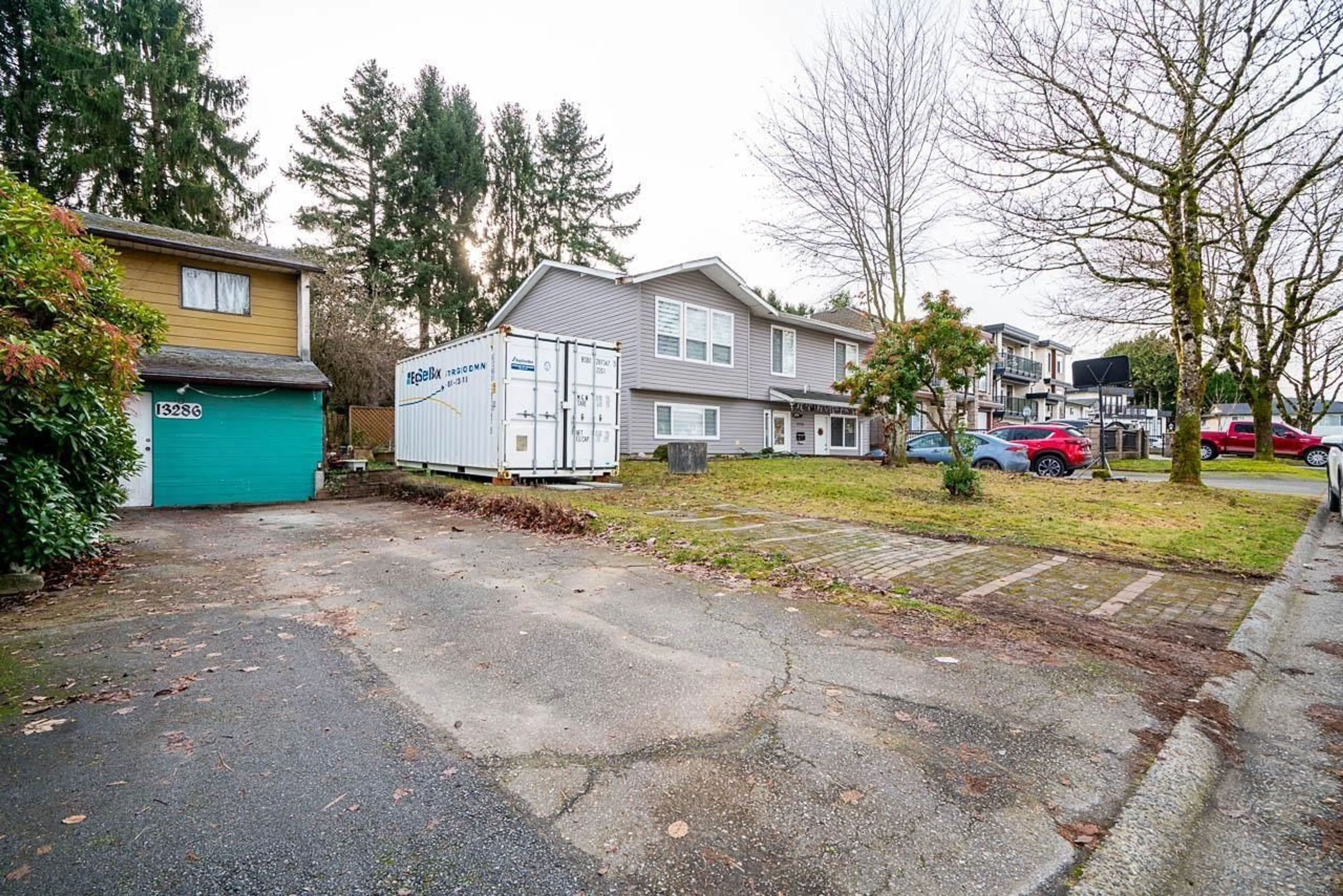 A pic from outside/outdoor area/front of a property/back of a property/a pic from drone, street for 13286 78A AVENUE, Surrey British Columbia V3W7B7