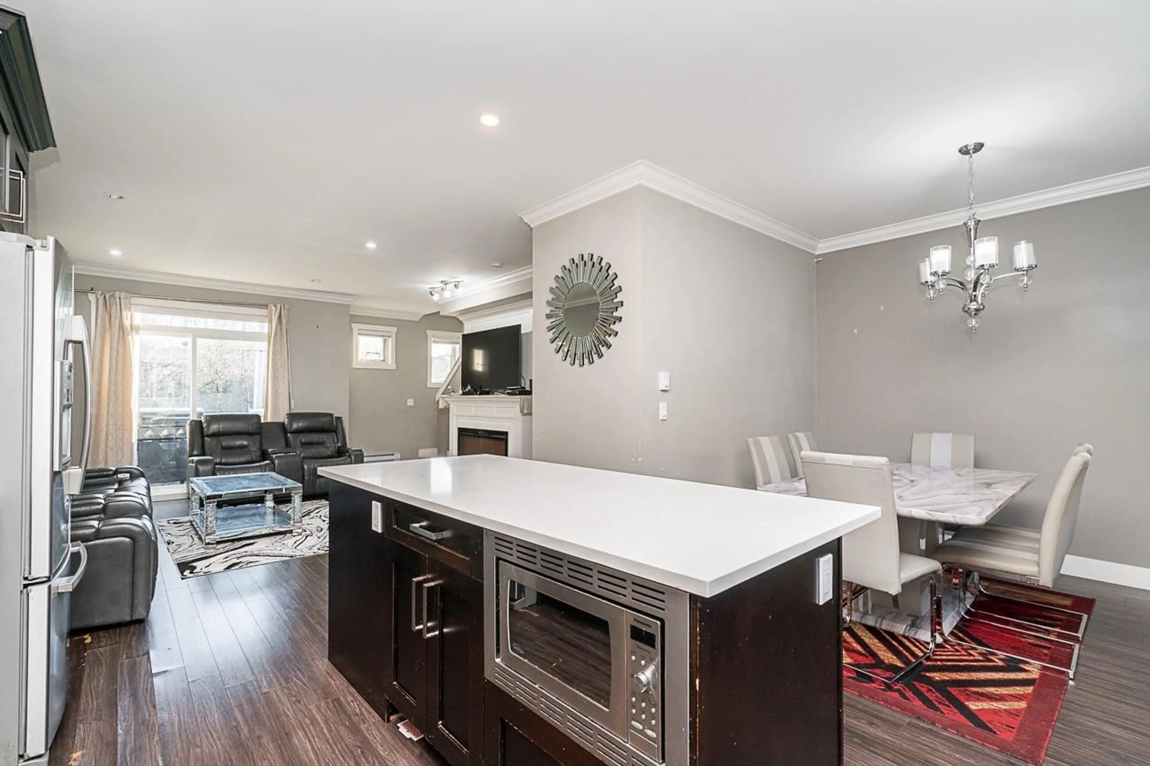 Open concept kitchen, wood/laminate floor for 4 14285 64 AVENUE, Surrey British Columbia V3W1Z2