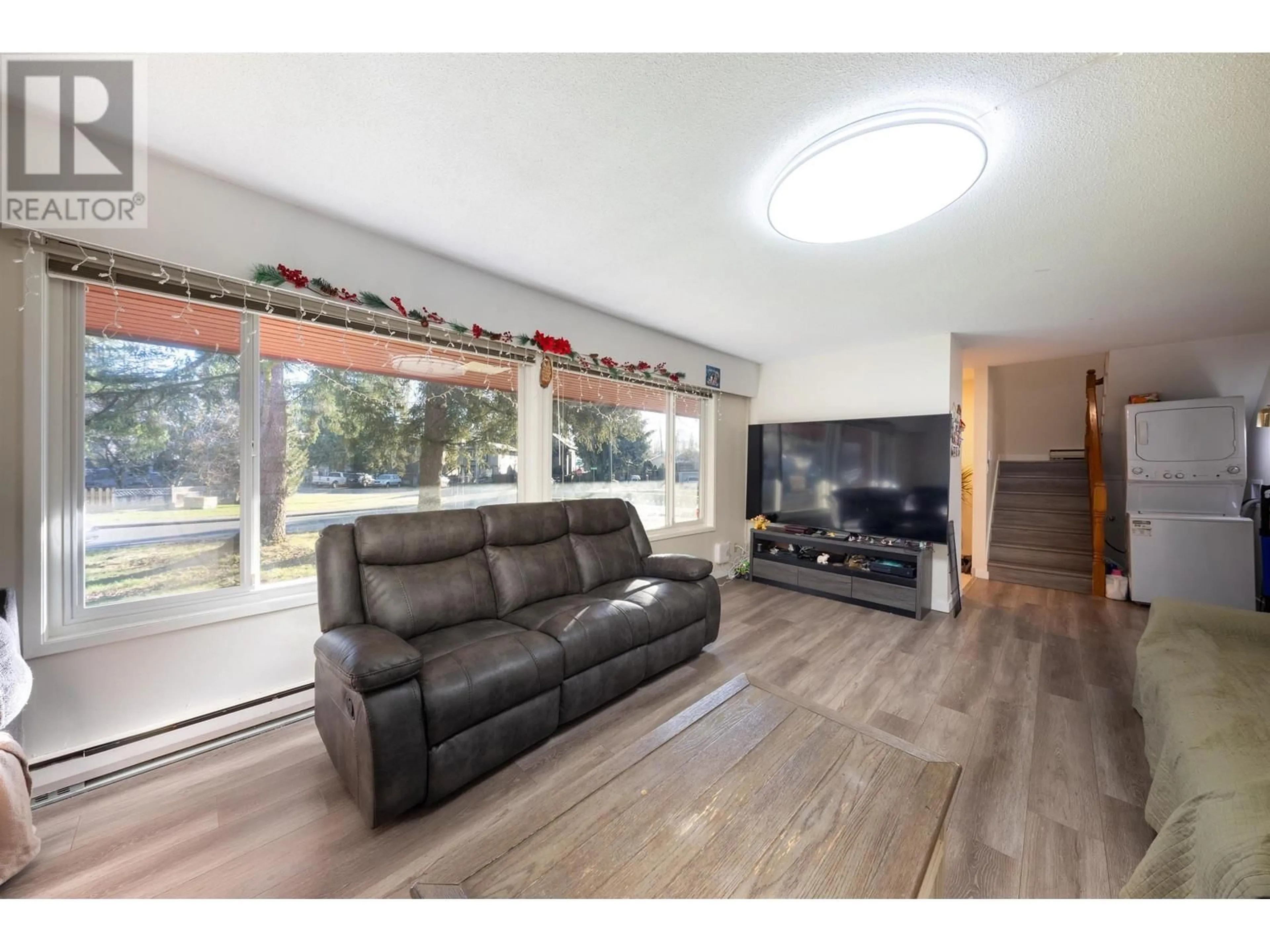 Living room with furniture, wood/laminate floor for 830 IRVINE STREET, Coquitlam British Columbia V3C4C2