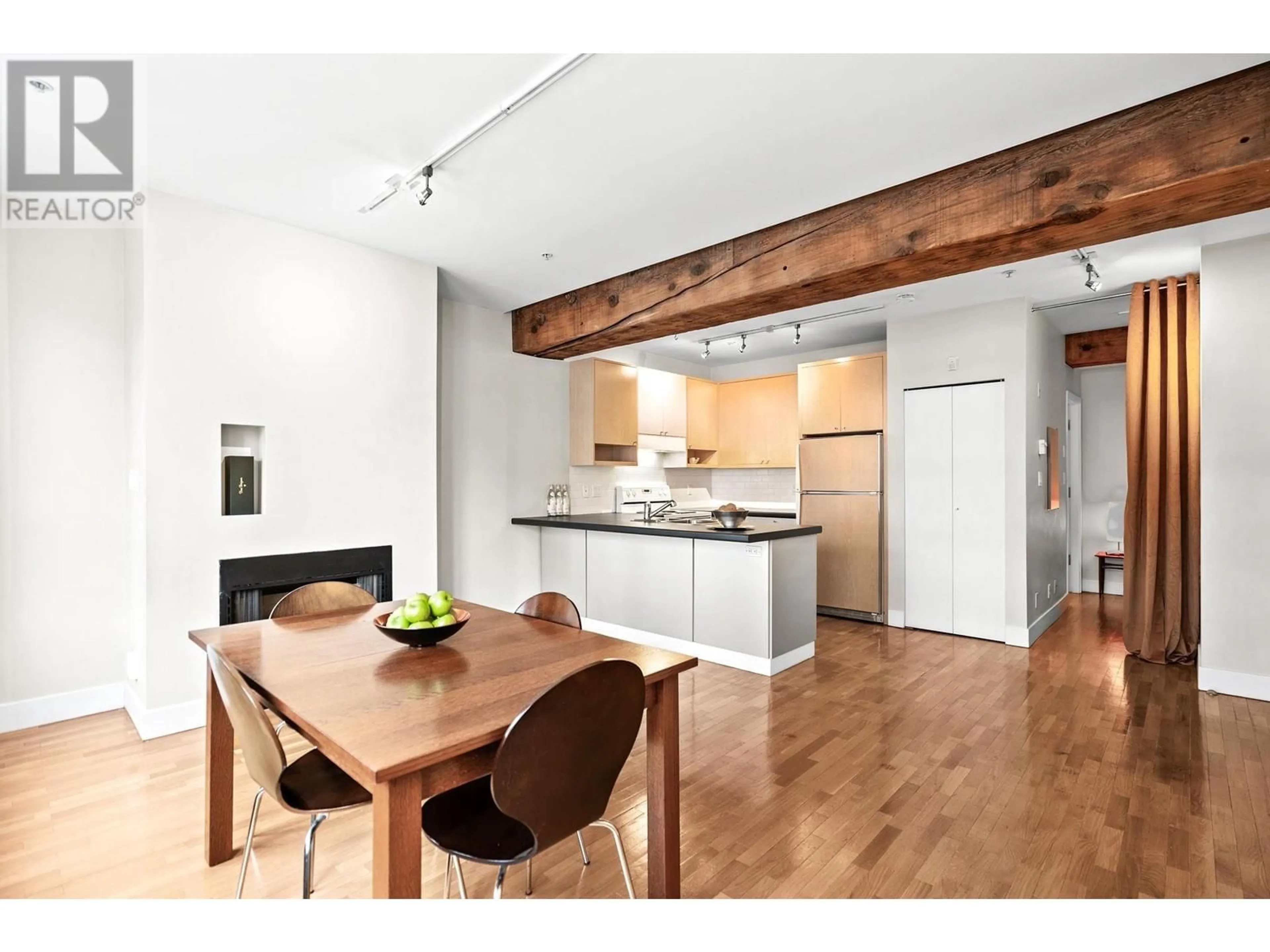 Open concept kitchen, wood/laminate floor for 201 869 BEATTY STREET, Vancouver British Columbia V6B2M6