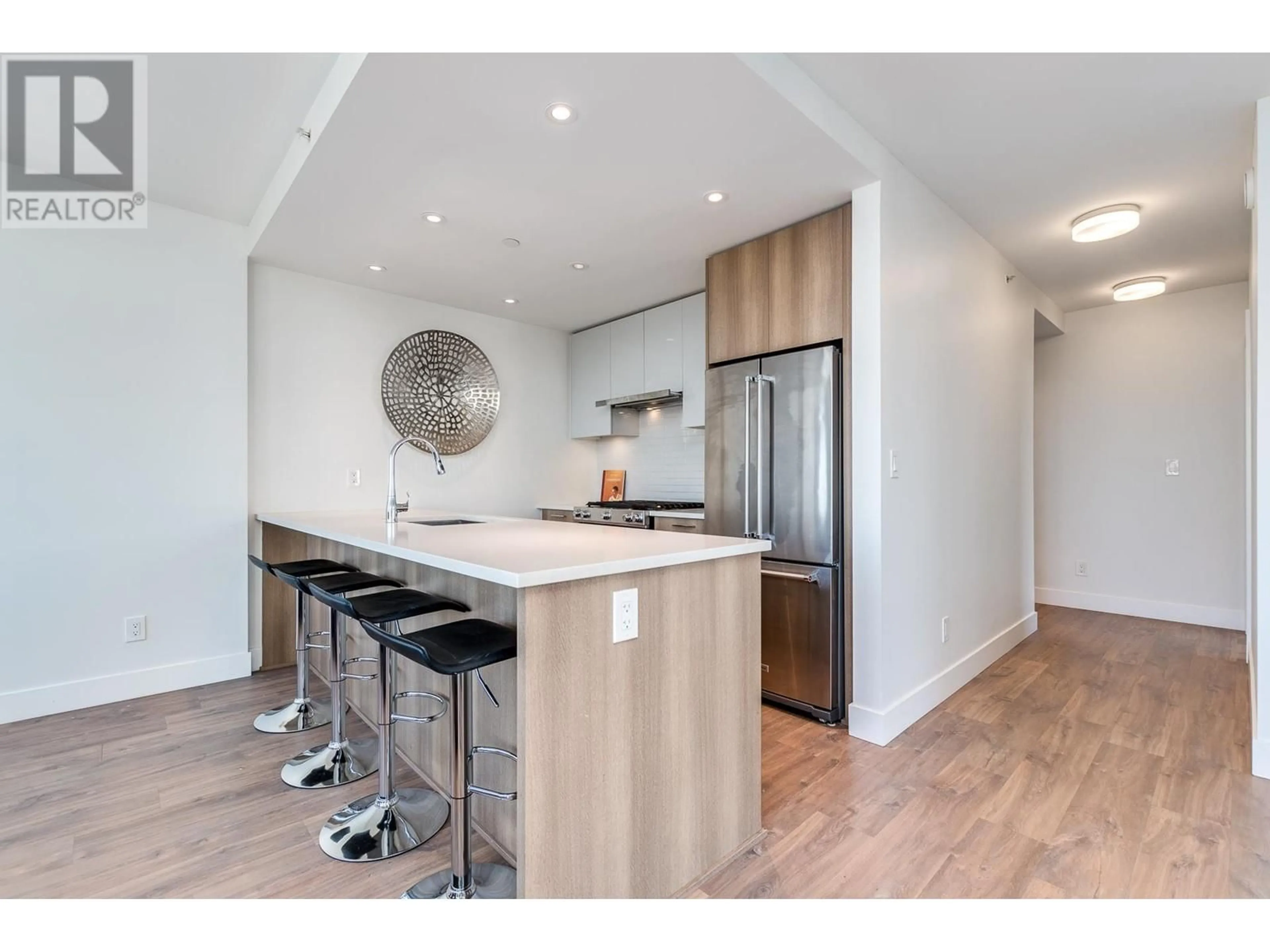 Open concept kitchen, wood/laminate floor for 1207 258 NELSON'S COURT, New Westminster British Columbia V3L0J9