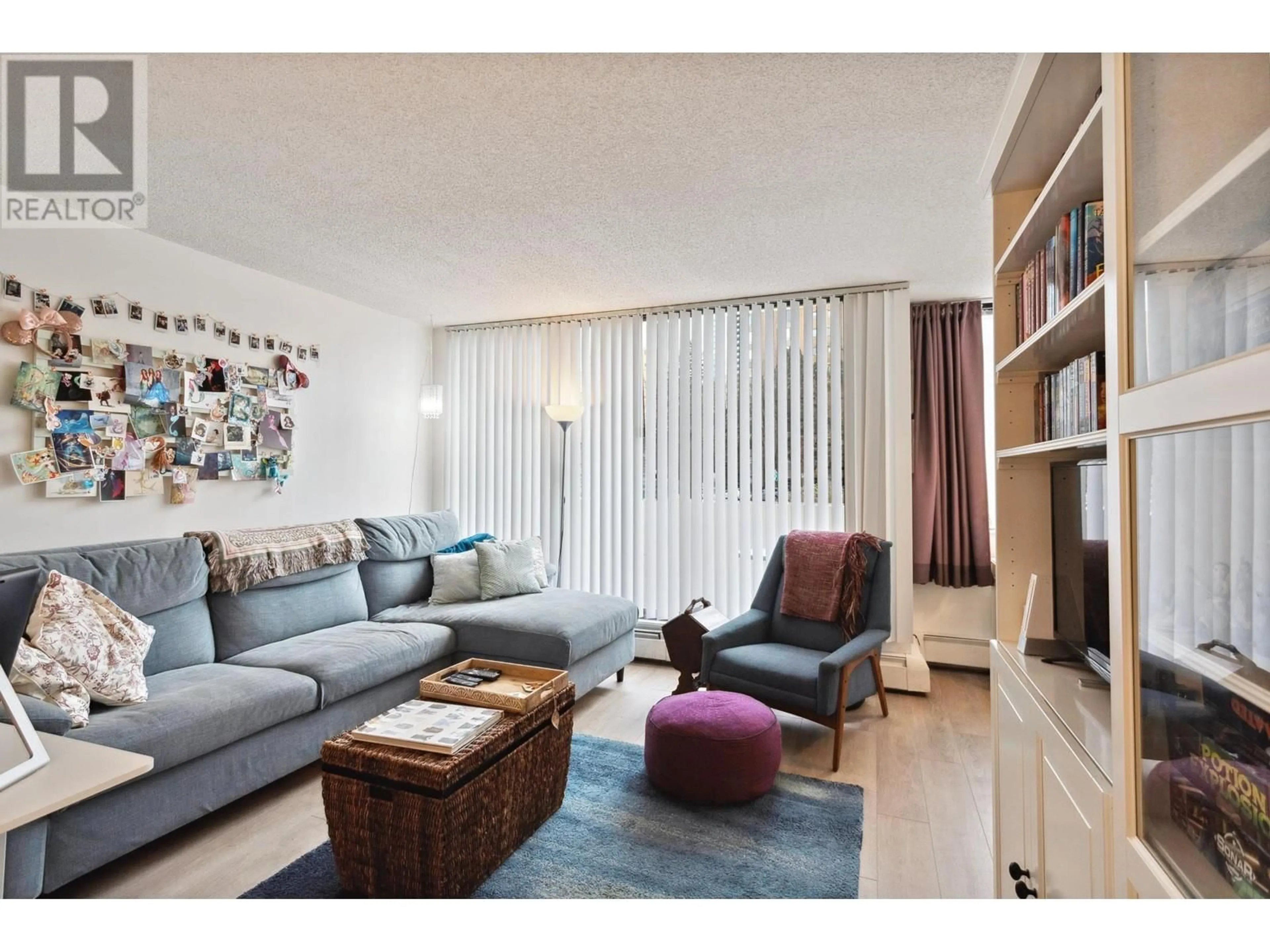 Living room with furniture, wood/laminate floor for 204 4200 MAYBERRY STREET, Burnaby British Columbia V5H4A7