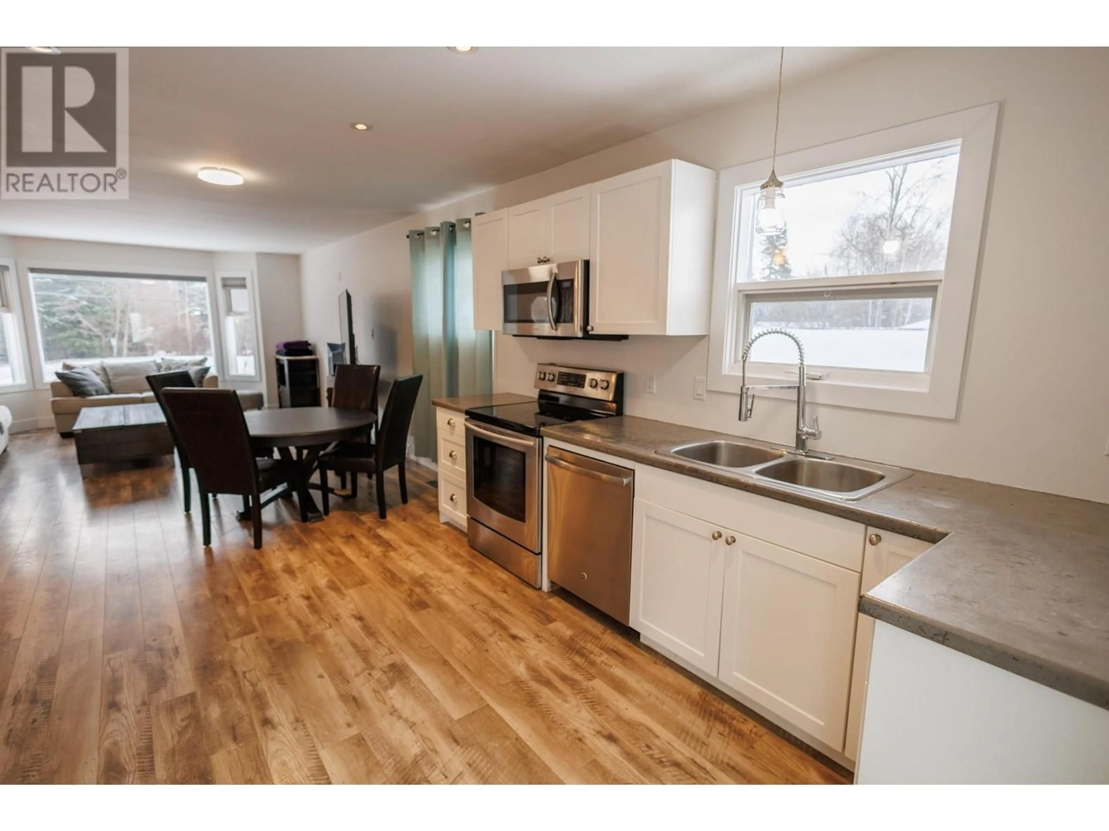 Open concept kitchen, wood/laminate floor for 2407 A KENNEY STREET, Terrace British Columbia V8G3E2