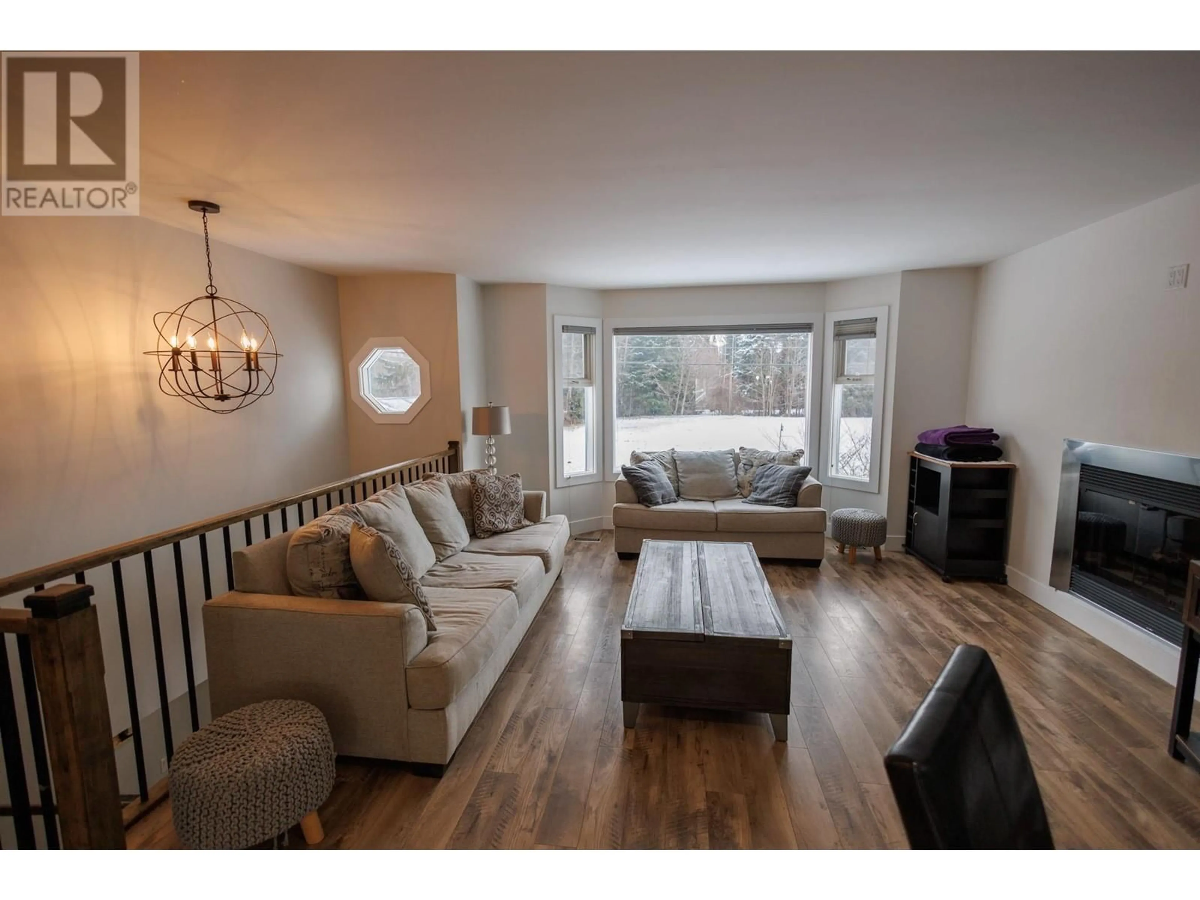 Living room with furniture, wood/laminate floor for 2407 A KENNEY STREET, Terrace British Columbia V8G3E2