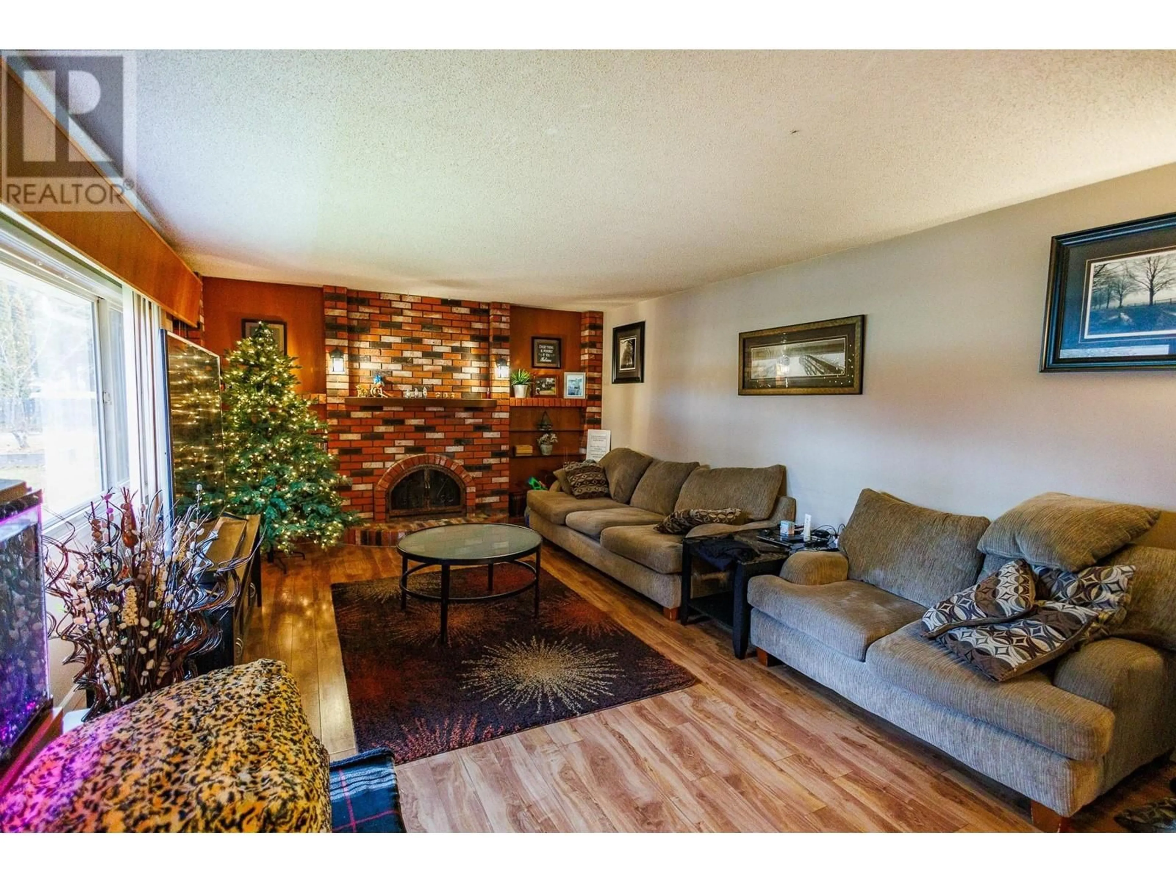 Living room with furniture, wood/laminate floor for 4827 DAVIS AVENUE, Terrace British Columbia V8G1Y2