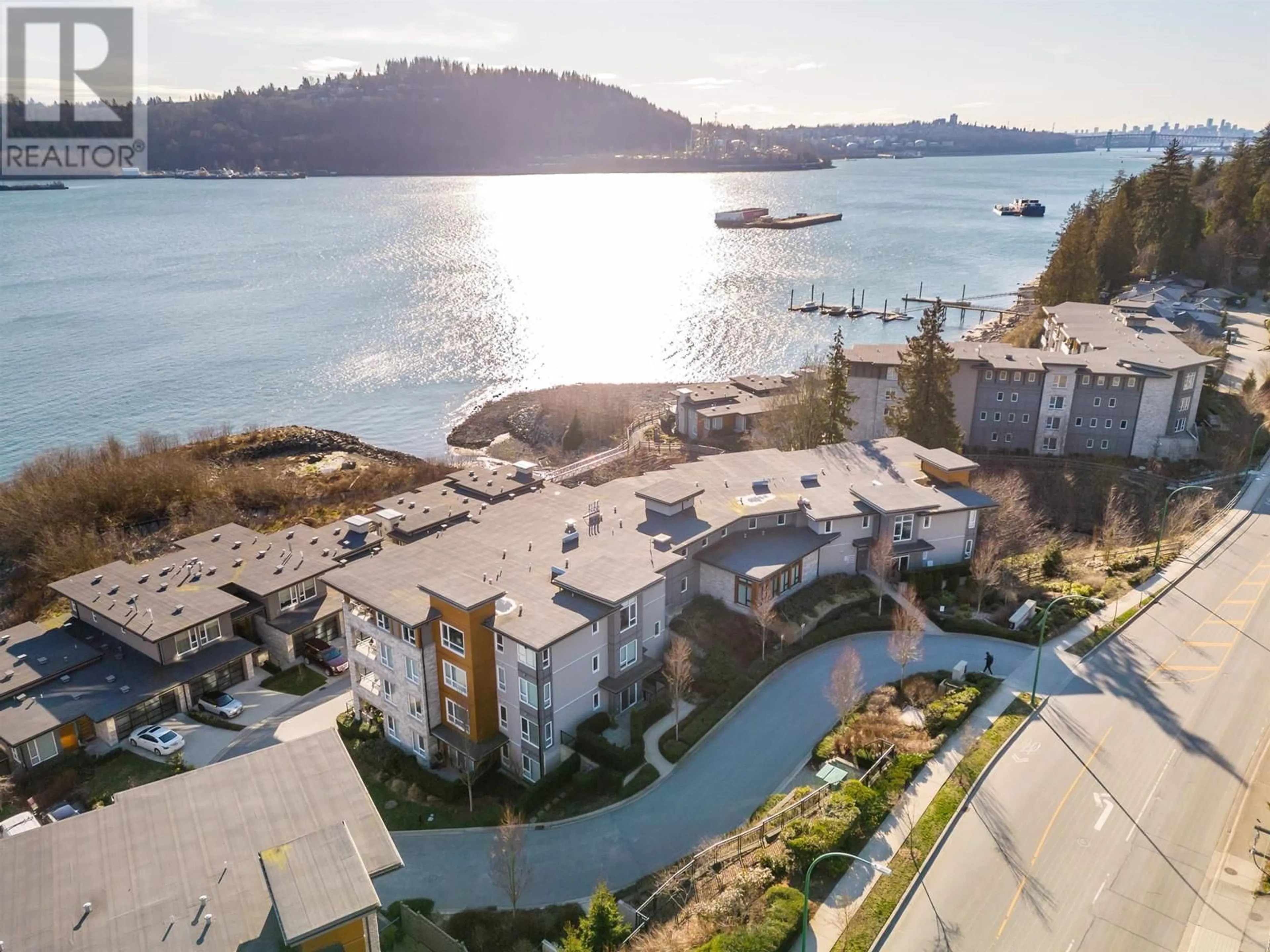 A pic from outside/outdoor area/front of a property/back of a property/a pic from drone, water/lake/river/ocean view for 405 3873 CATES LANDING WAY, North Vancouver British Columbia V7G0A6