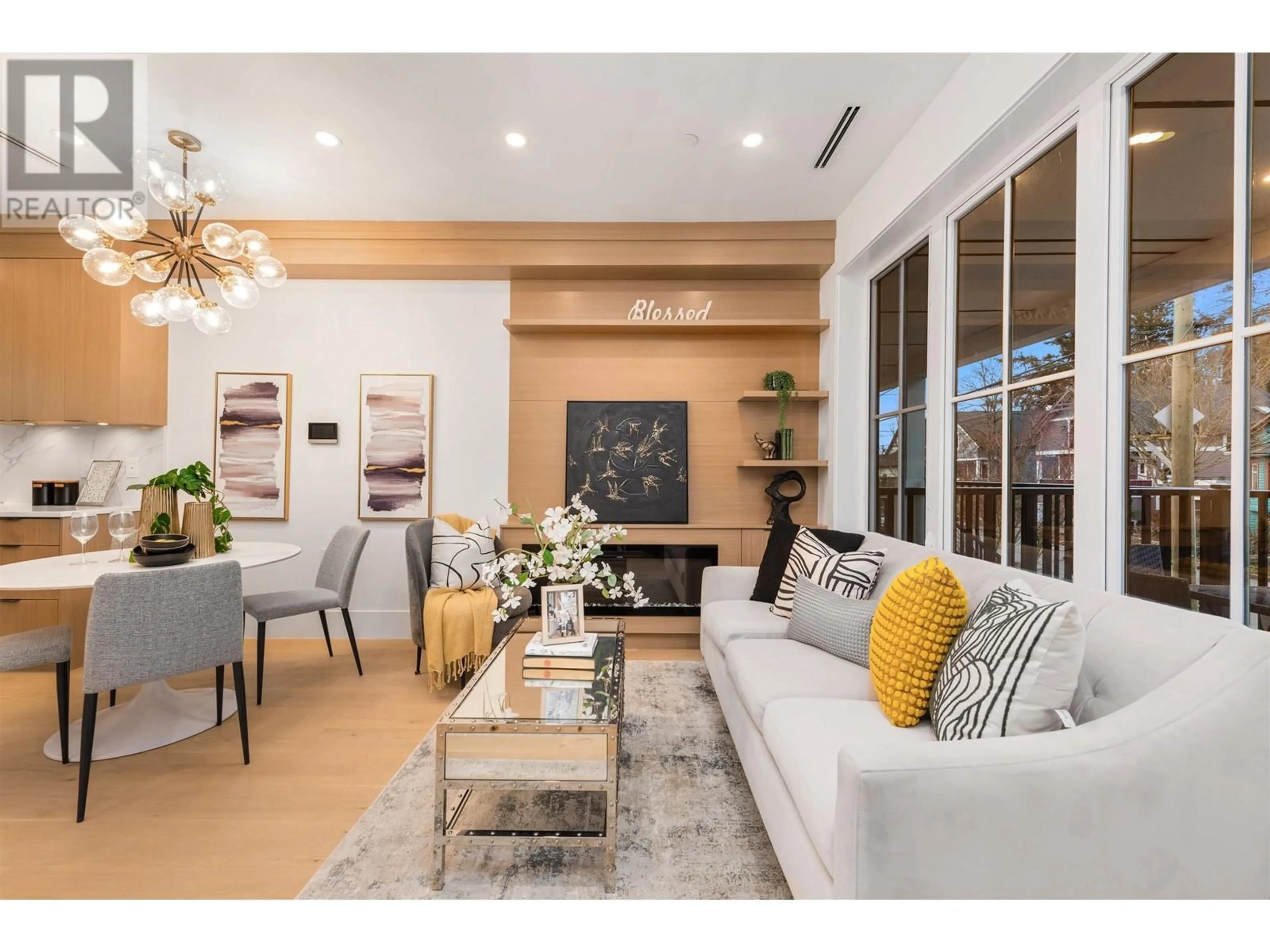 Living room with furniture, wood/laminate floor for 2052 FERNDALE STREET, Vancouver British Columbia V5L1Y1