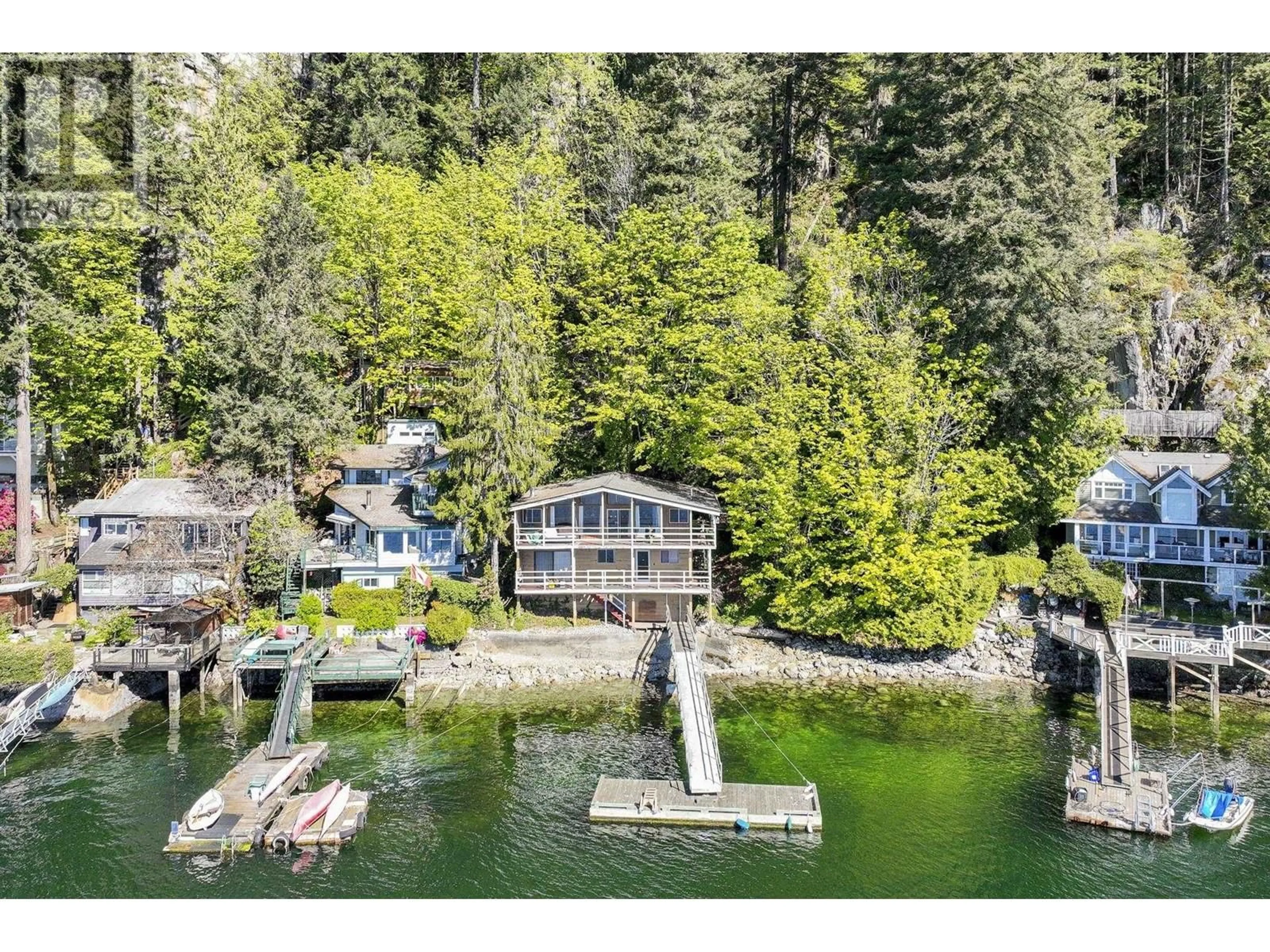 A pic from outside/outdoor area/front of a property/back of a property/a pic from drone, water/lake/river/ocean view for 5672 INDIAN RIVER DRIVE, North Vancouver British Columbia V7G2T8