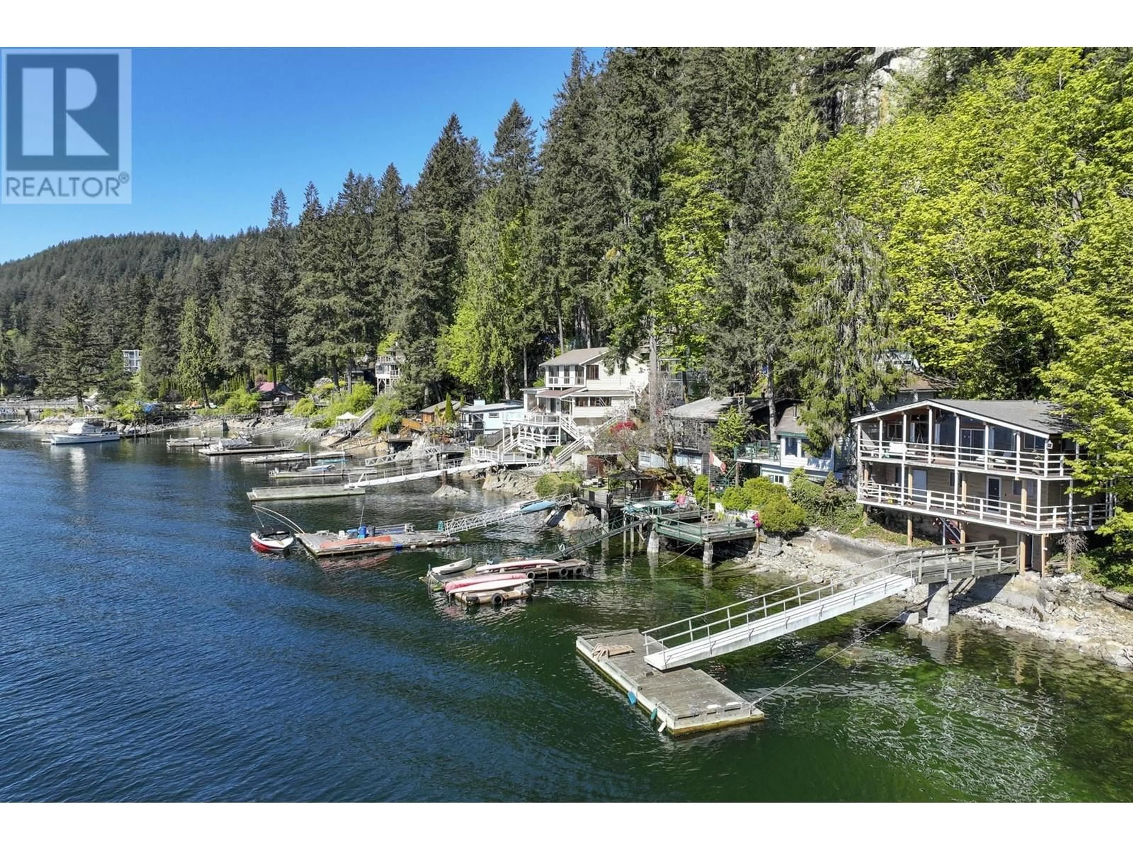 A pic from outside/outdoor area/front of a property/back of a property/a pic from drone, water/lake/river/ocean view for 5672 INDIAN RIVER DRIVE, North Vancouver British Columbia V7G2T8