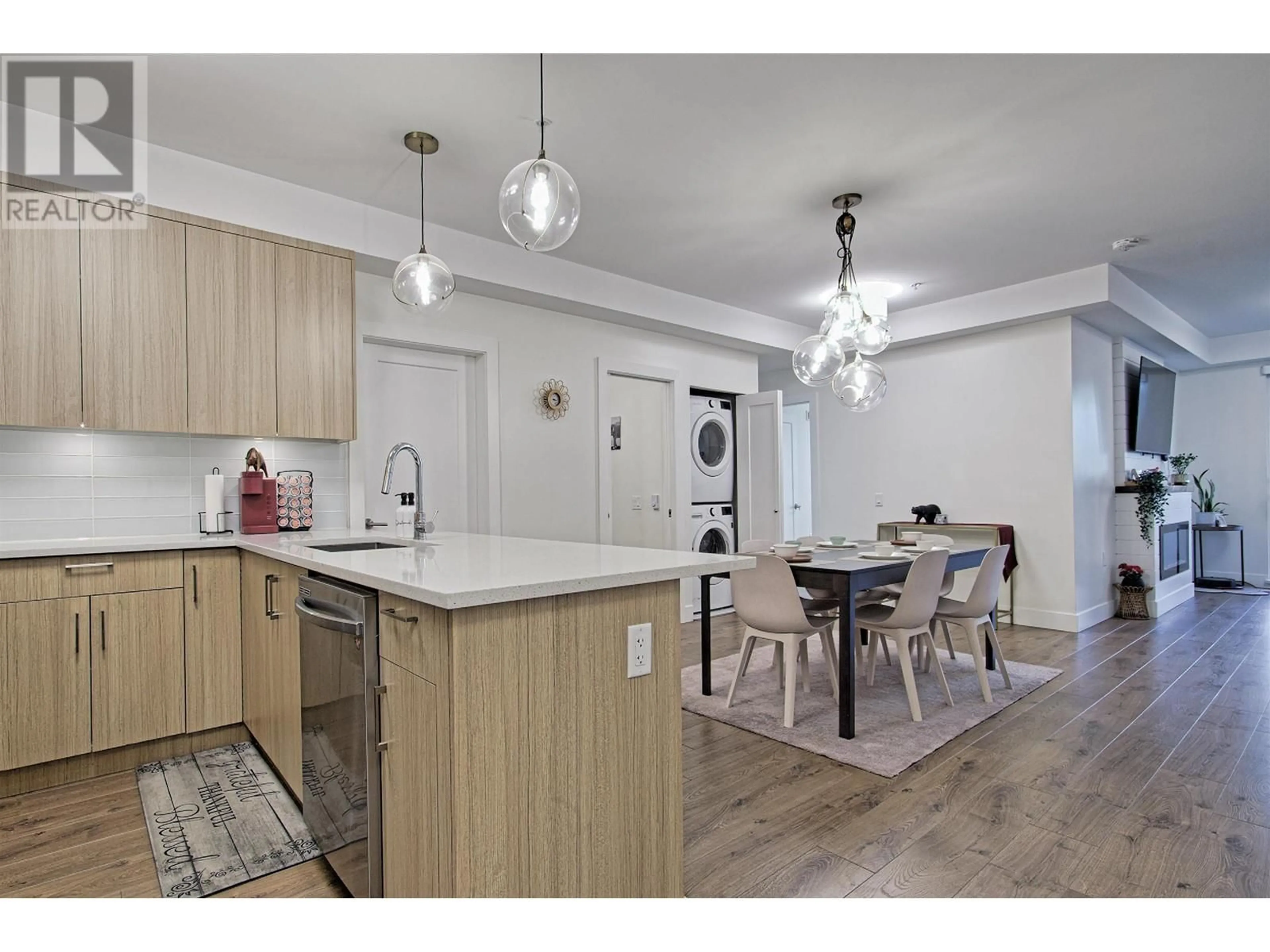 Open concept kitchen, wood/laminate floor for 303 12460 191 STREET, Pitt Meadows British Columbia V3Y2J2