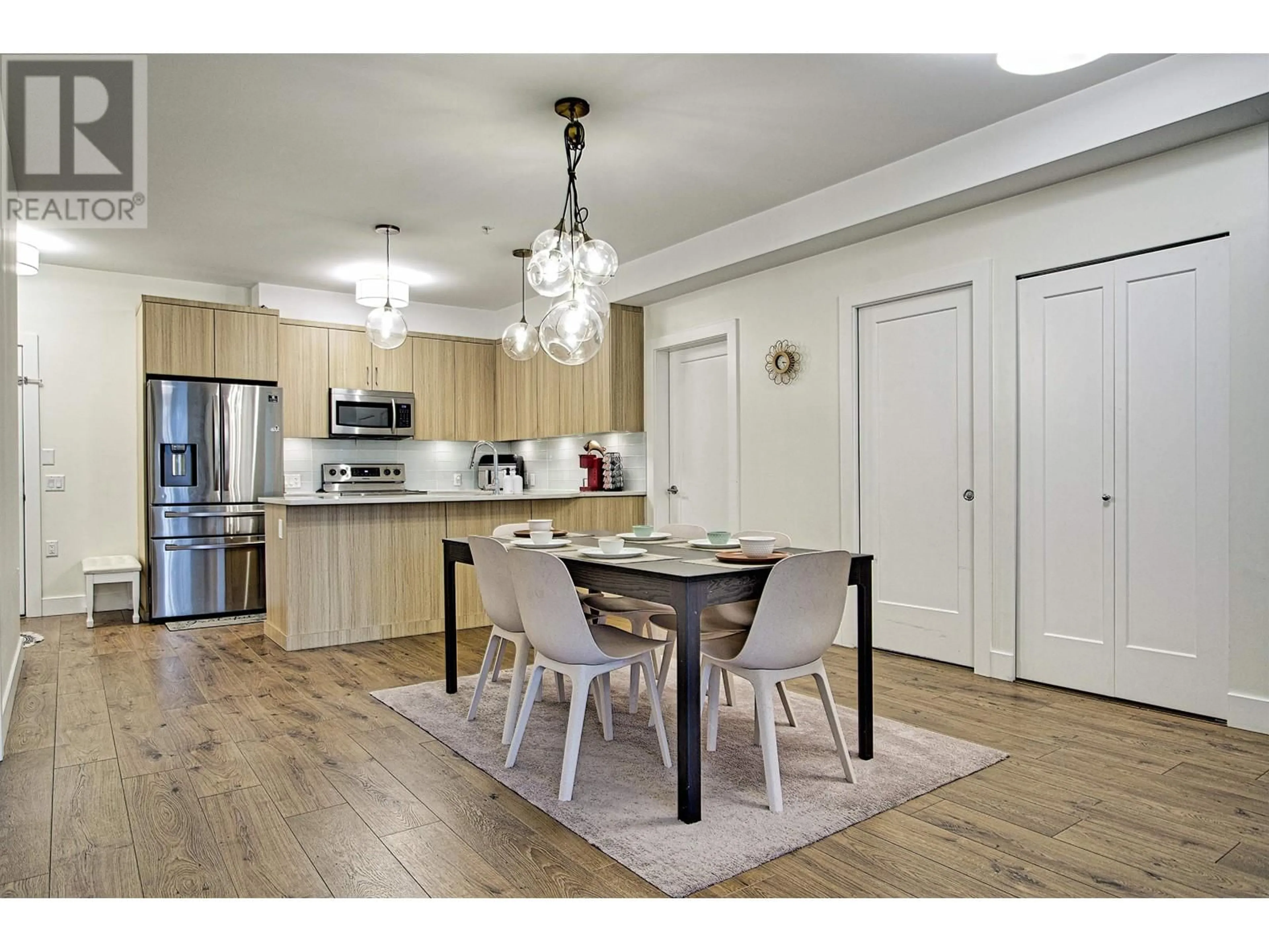 Open concept kitchen, wood/laminate floor for 303 12460 191 STREET, Pitt Meadows British Columbia V3Y2J2