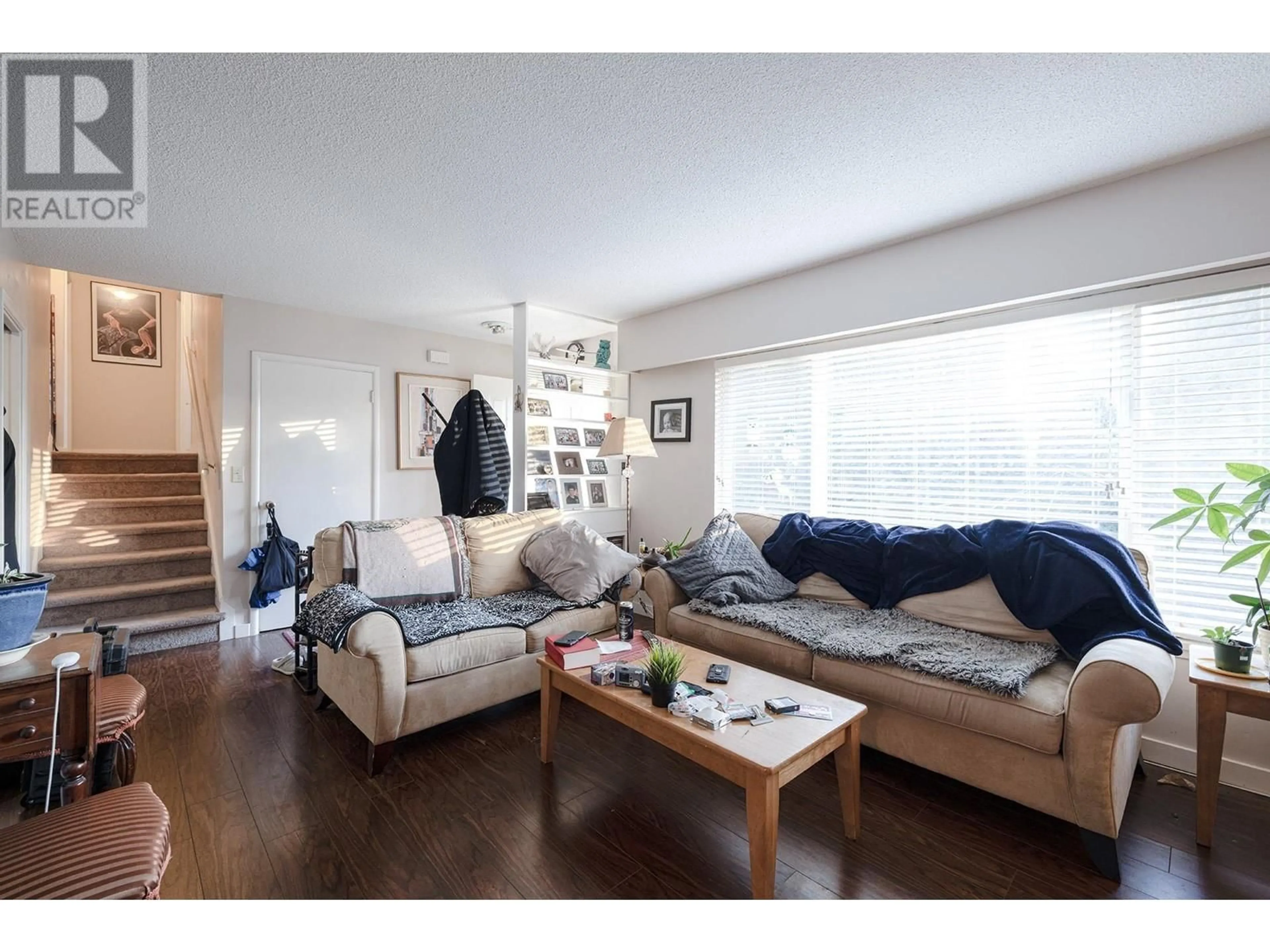 Living room with furniture, wood/laminate floor for 3871 YOUNGMORE ROAD, Richmond British Columbia V7C1R5