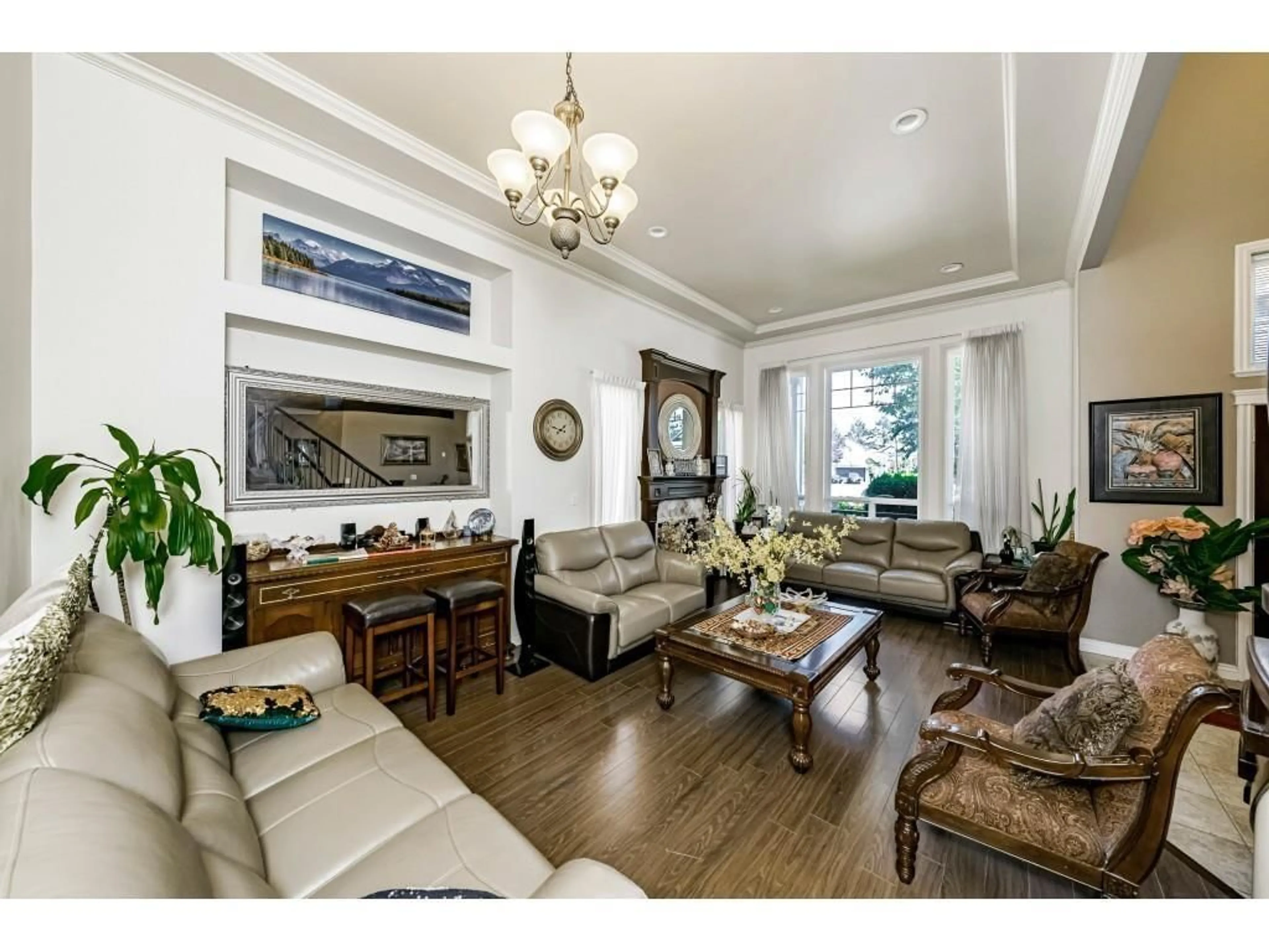 Living room with furniture, wood/laminate floor for 7833 147A STREET, Surrey British Columbia V3S2T8