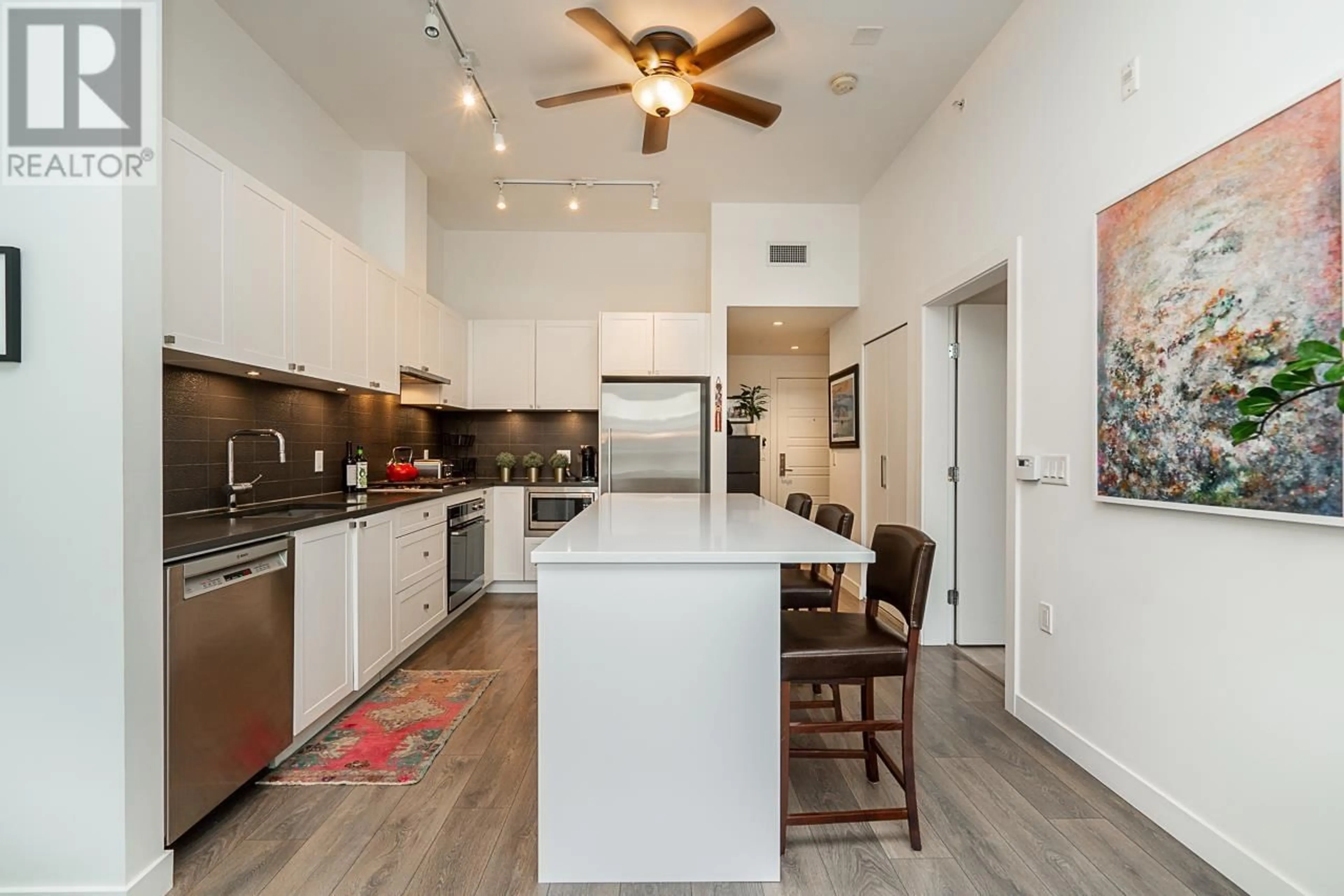 Open concept kitchen, ceramic/tile floor for 208 105 W 2ND STREET, North Vancouver British Columbia V7M0E3