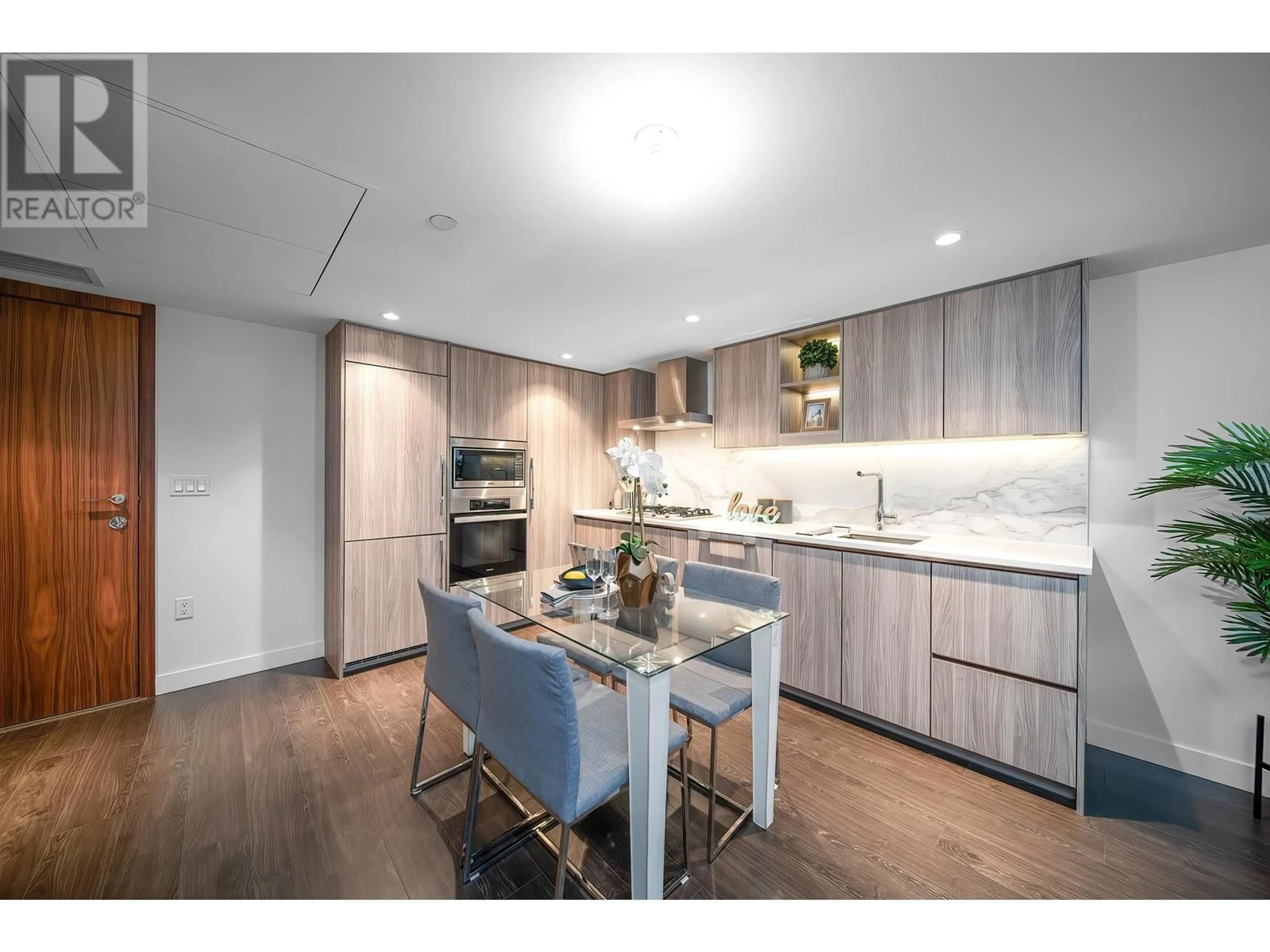 Open concept kitchen, wood/laminate floor for 605 8555 CAPSTAN WAY, Richmond British Columbia V6X0W1