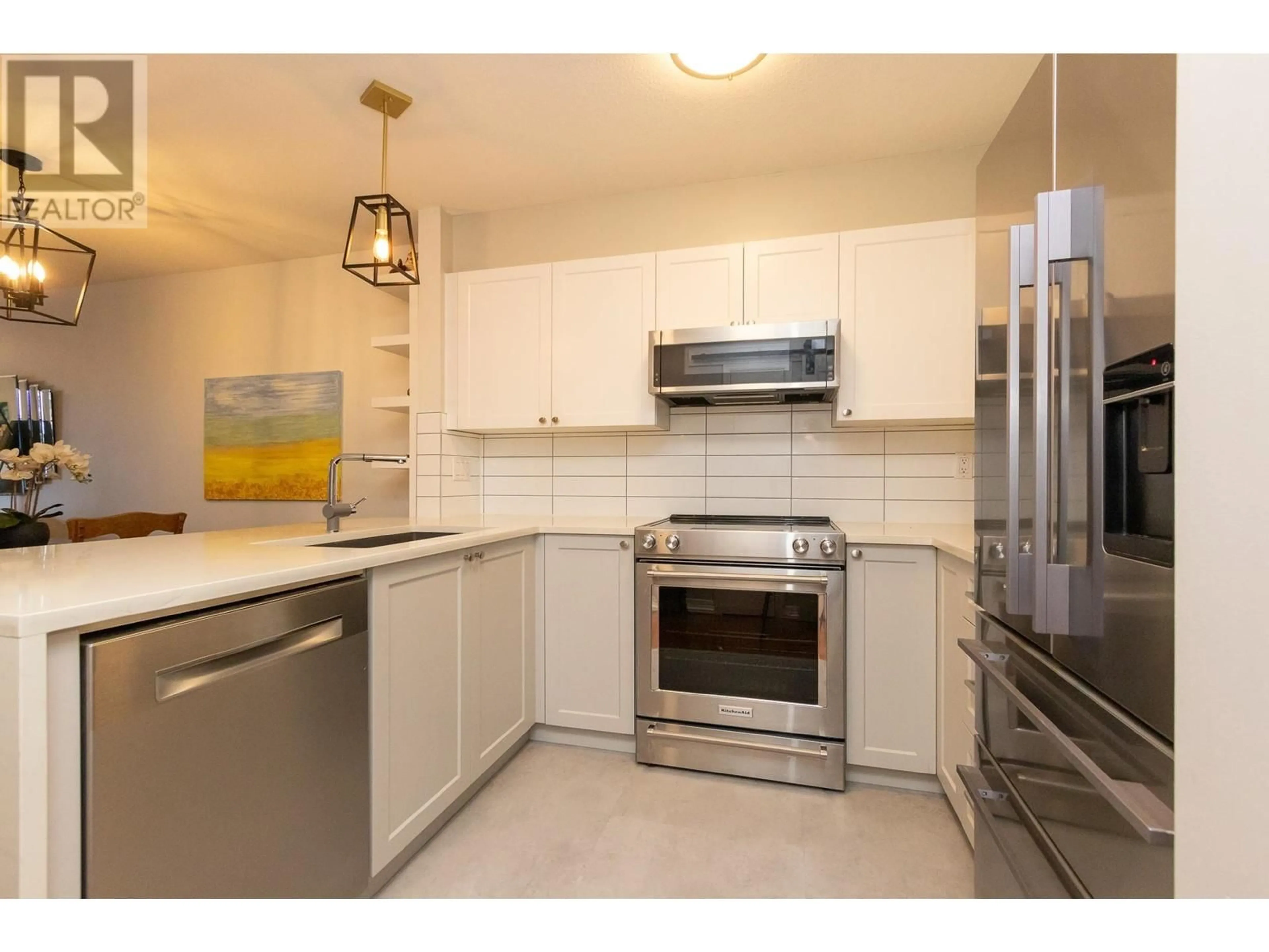 Standard kitchen, ceramic/tile floor for 215 147 E 1ST STREET, North Vancouver British Columbia V7L1B2