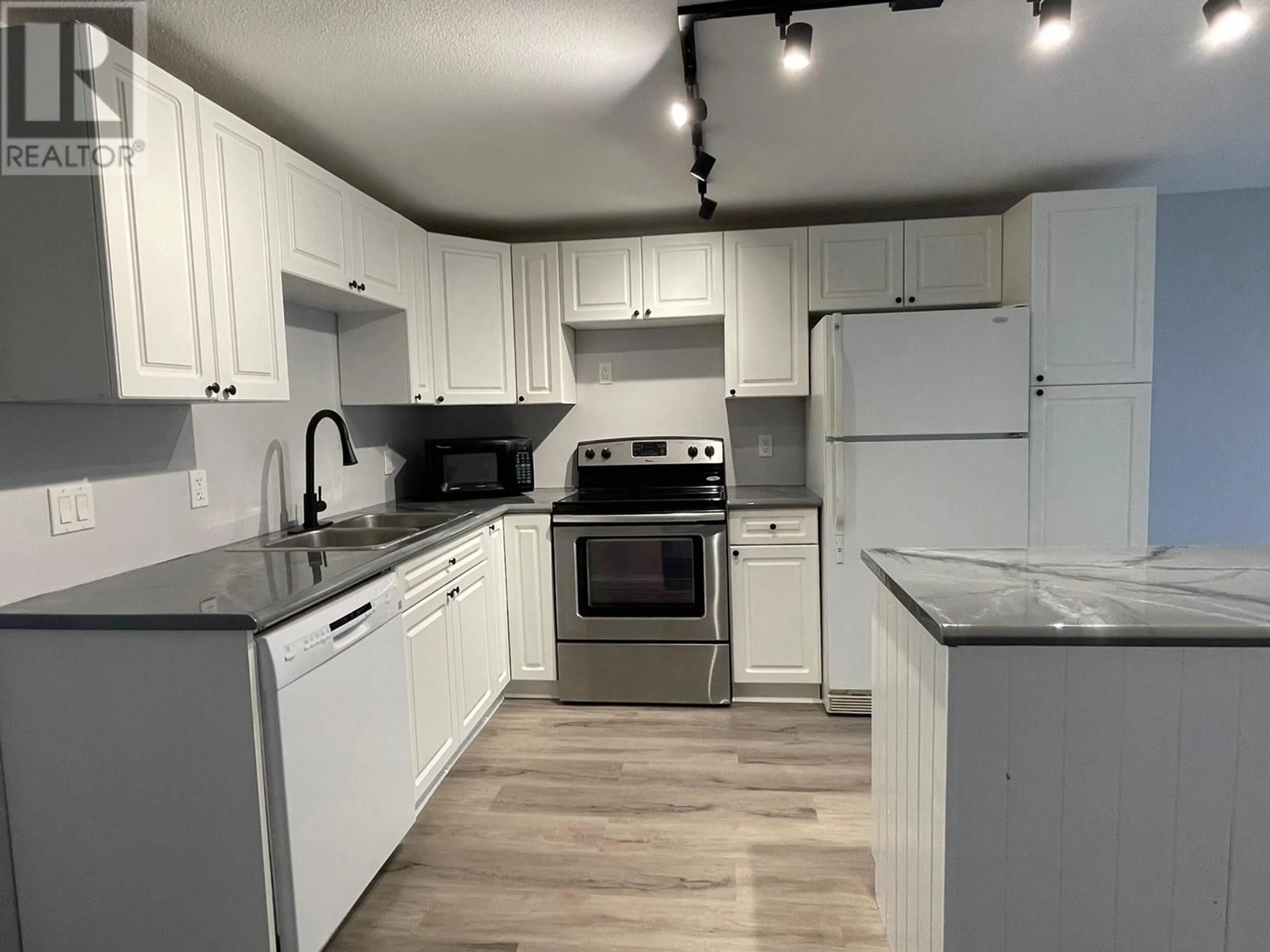 Standard kitchen, wood/laminate floor for 4423 E 53 AVENUE, Fort Nelson British Columbia V0C1R0