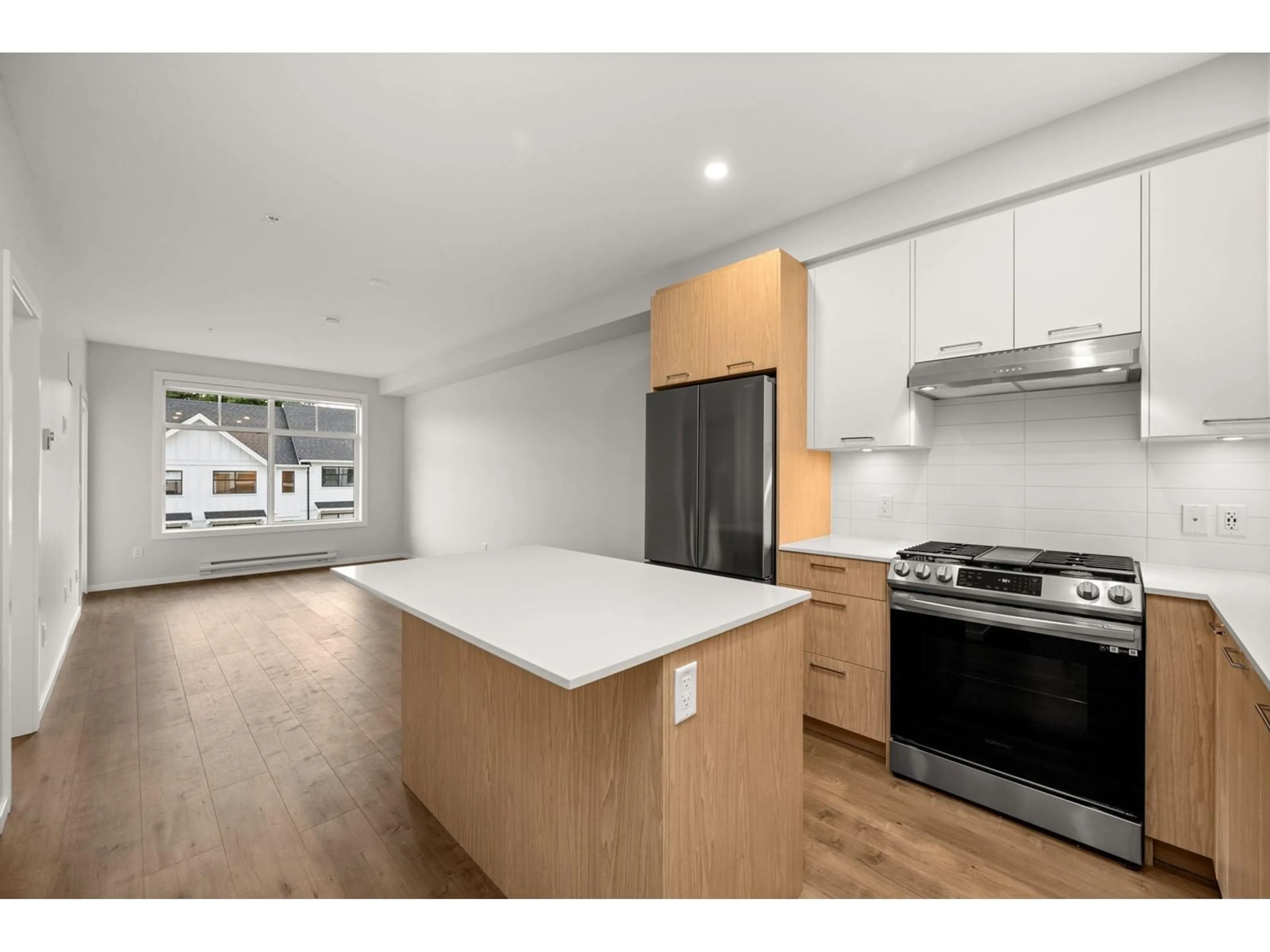 Open concept kitchen, wood/laminate floor for 414 3317 148 STREET, Surrey British Columbia V4P0H9